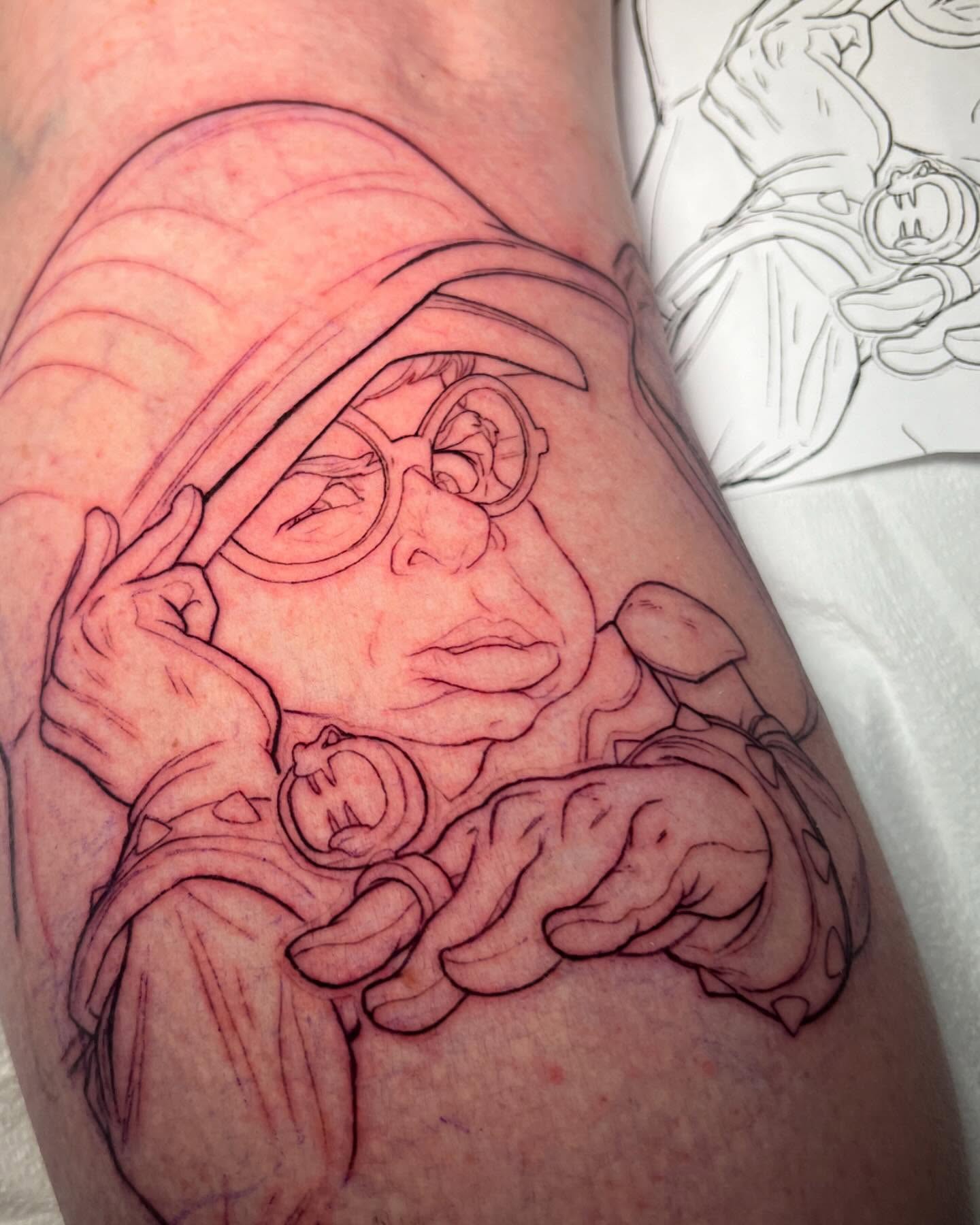Grandmother holding baby black and grey tattoo on the forearm by Tim Stafford
