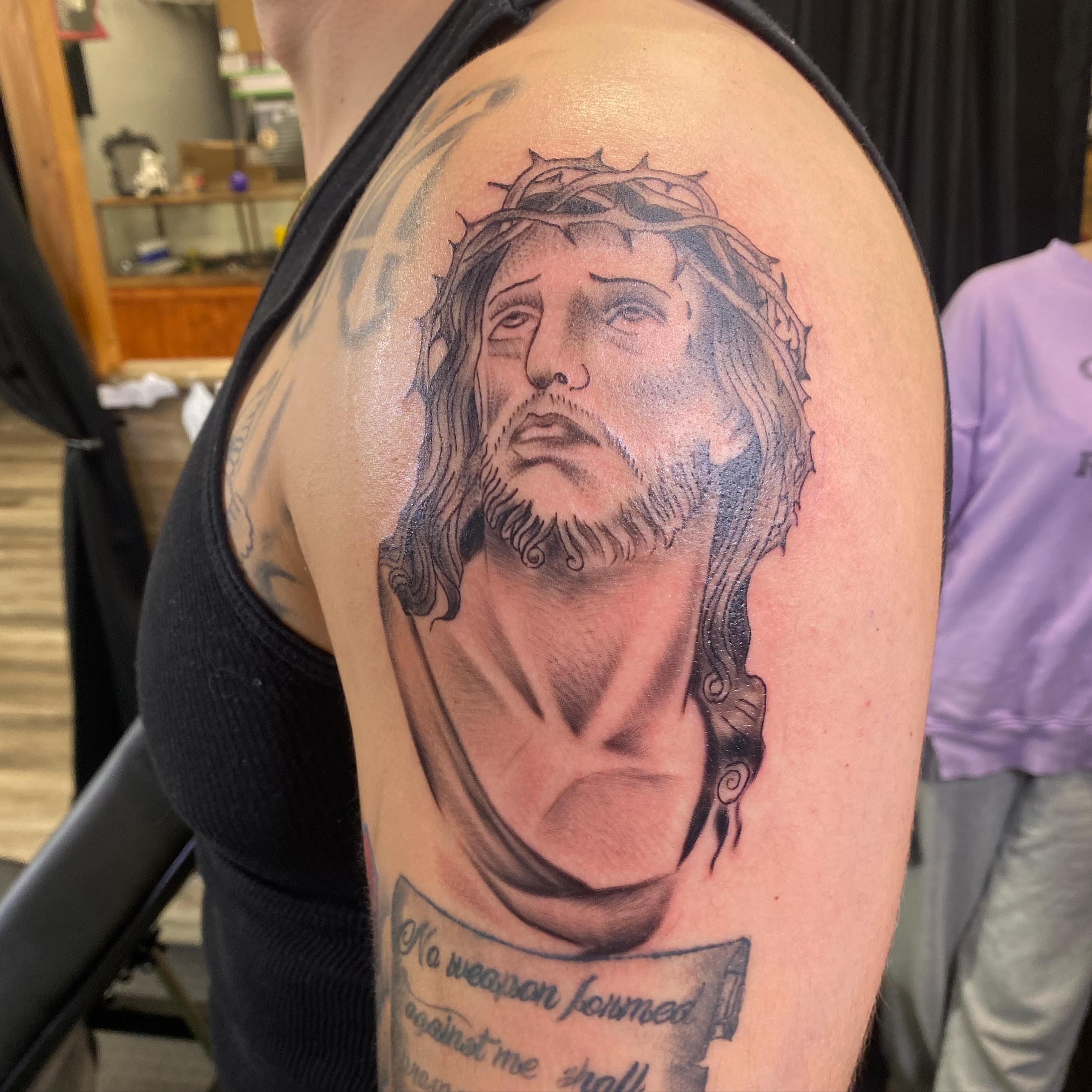 Religious figure realism tattoo on the shoulder by Spencer Jones Tattoos