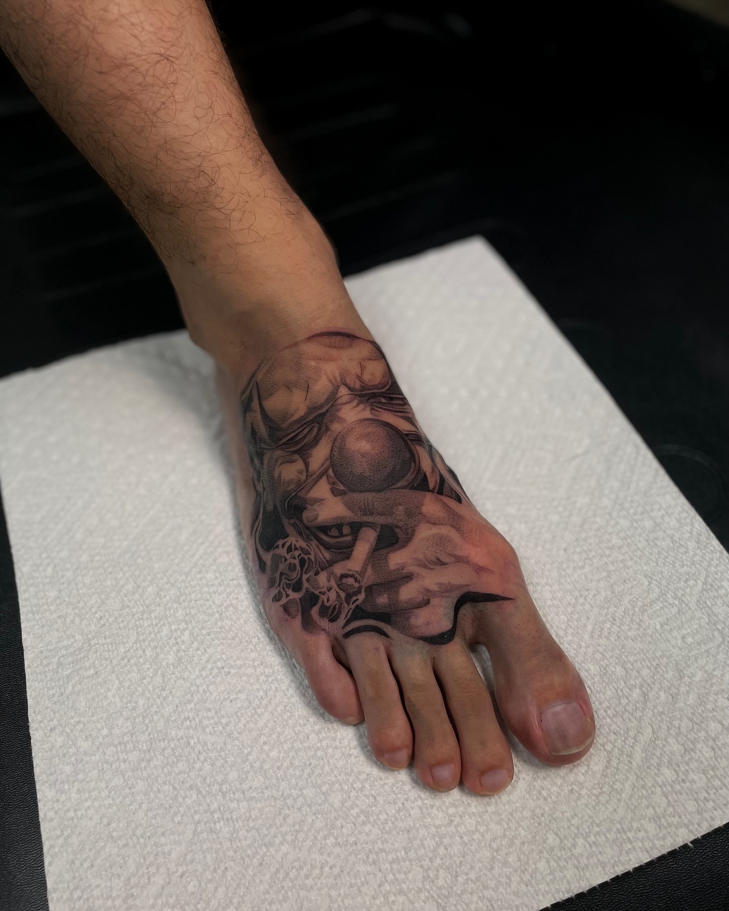 Eye and skull realism tattoo on the foot by Vanessa Valdivia