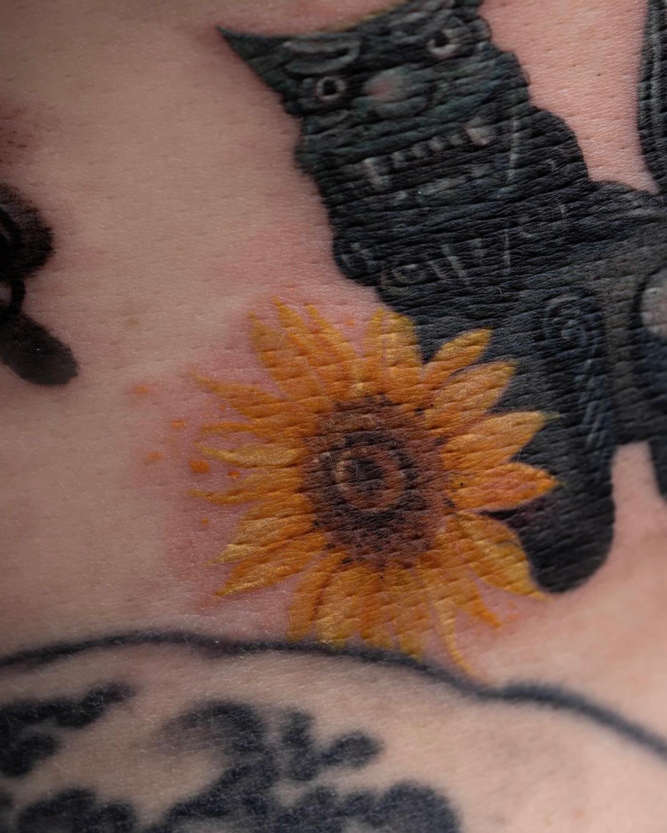 Sunflower dotwork tattoo on the chest by Tattooist hea