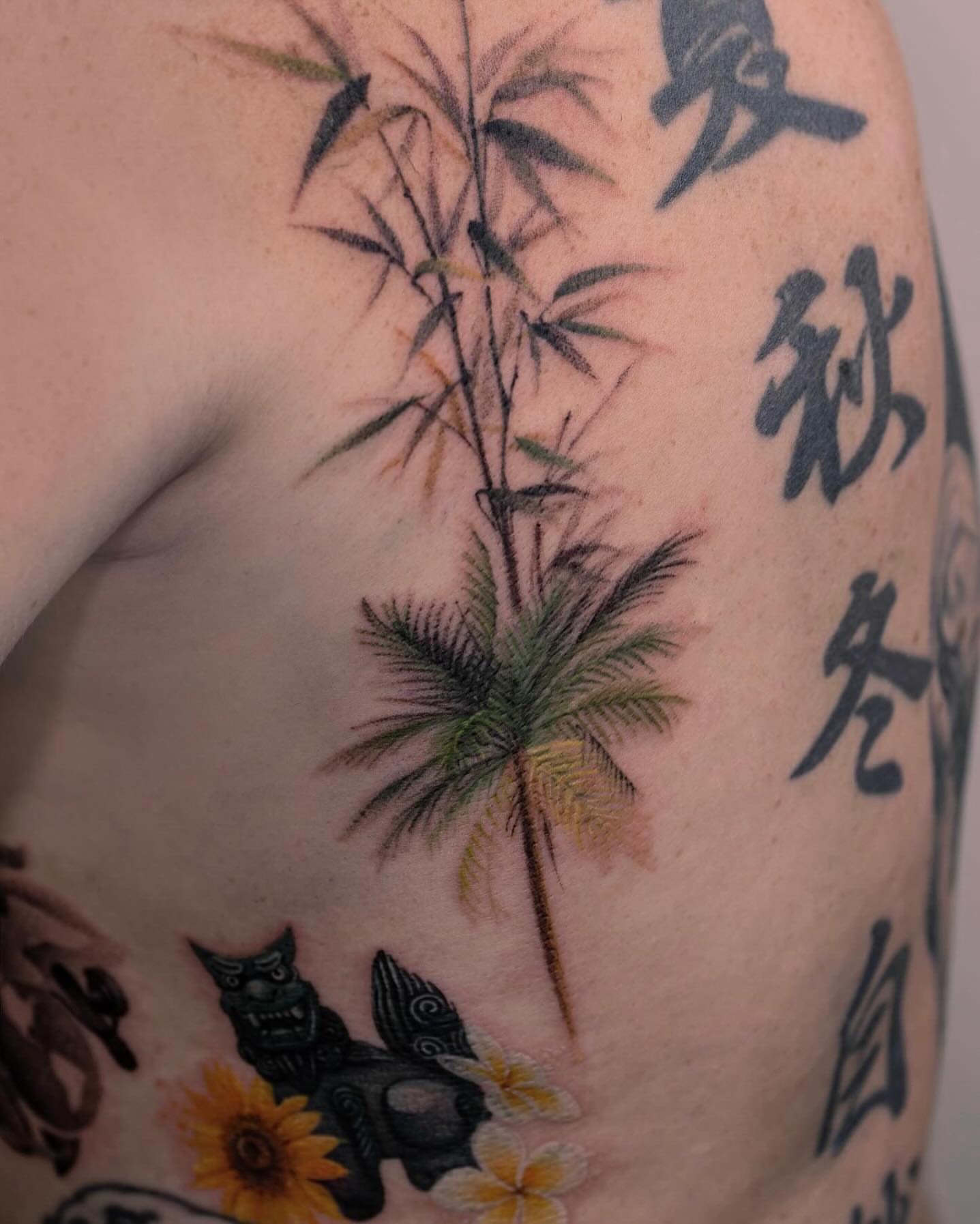 Bamboo and palm tree japanese irezumi tattoo on the shoulder by Tattooist hea