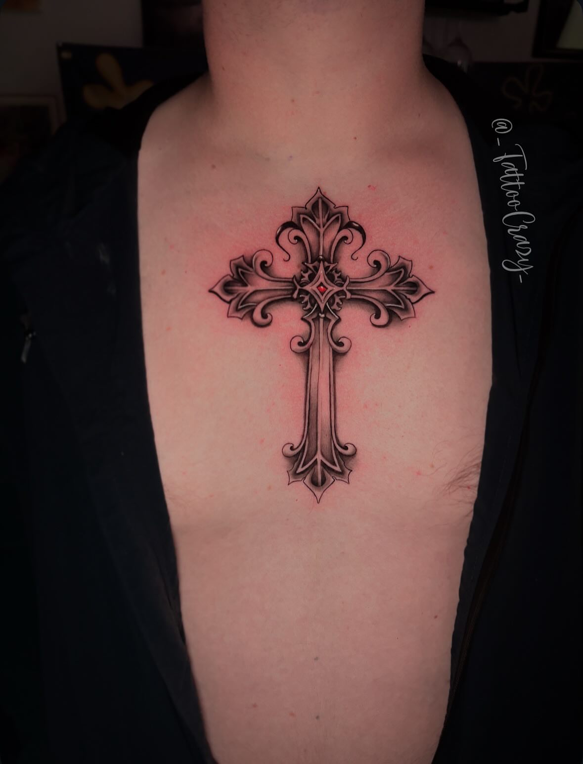 Cross ornamental tattoo on the chest by TattooCrazy🎭
