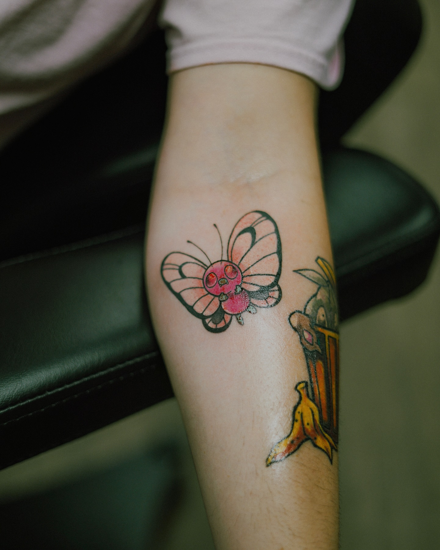 Butterfly new school tattoo on the forearm by Damon Moore