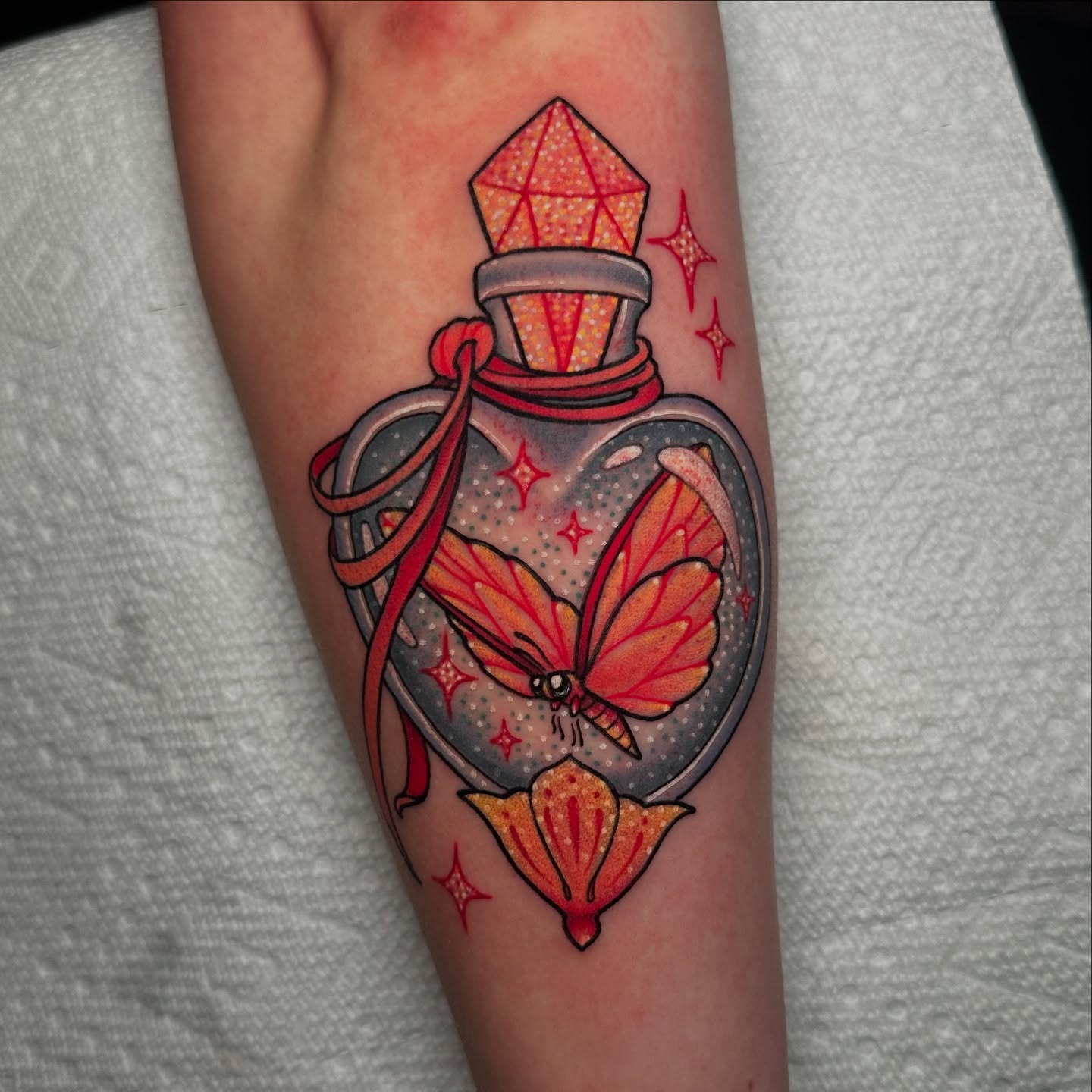 Bottle with butterfly dotwork tattoo on the forearm by Tayler Pearson, Fort Collins, Colorado