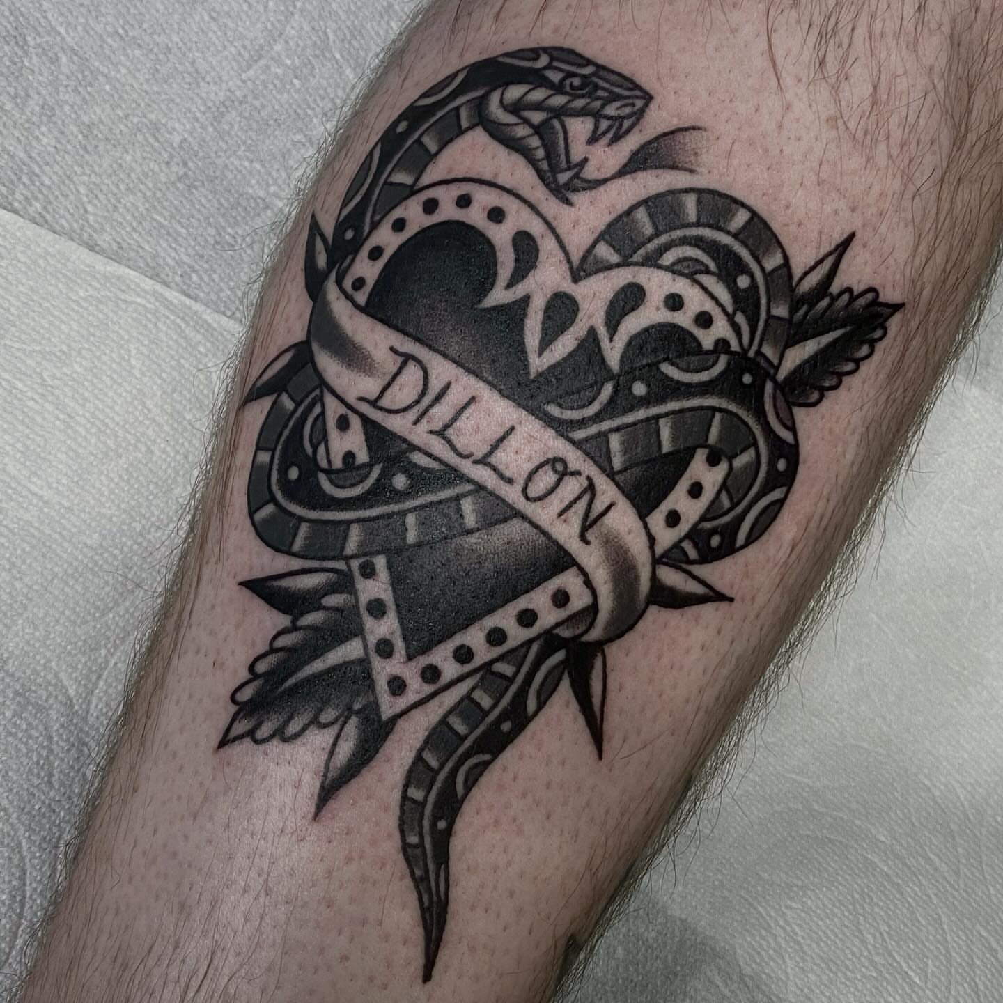 Snake and heart geometric tattoo on the forearm by Lindsey Cam Van