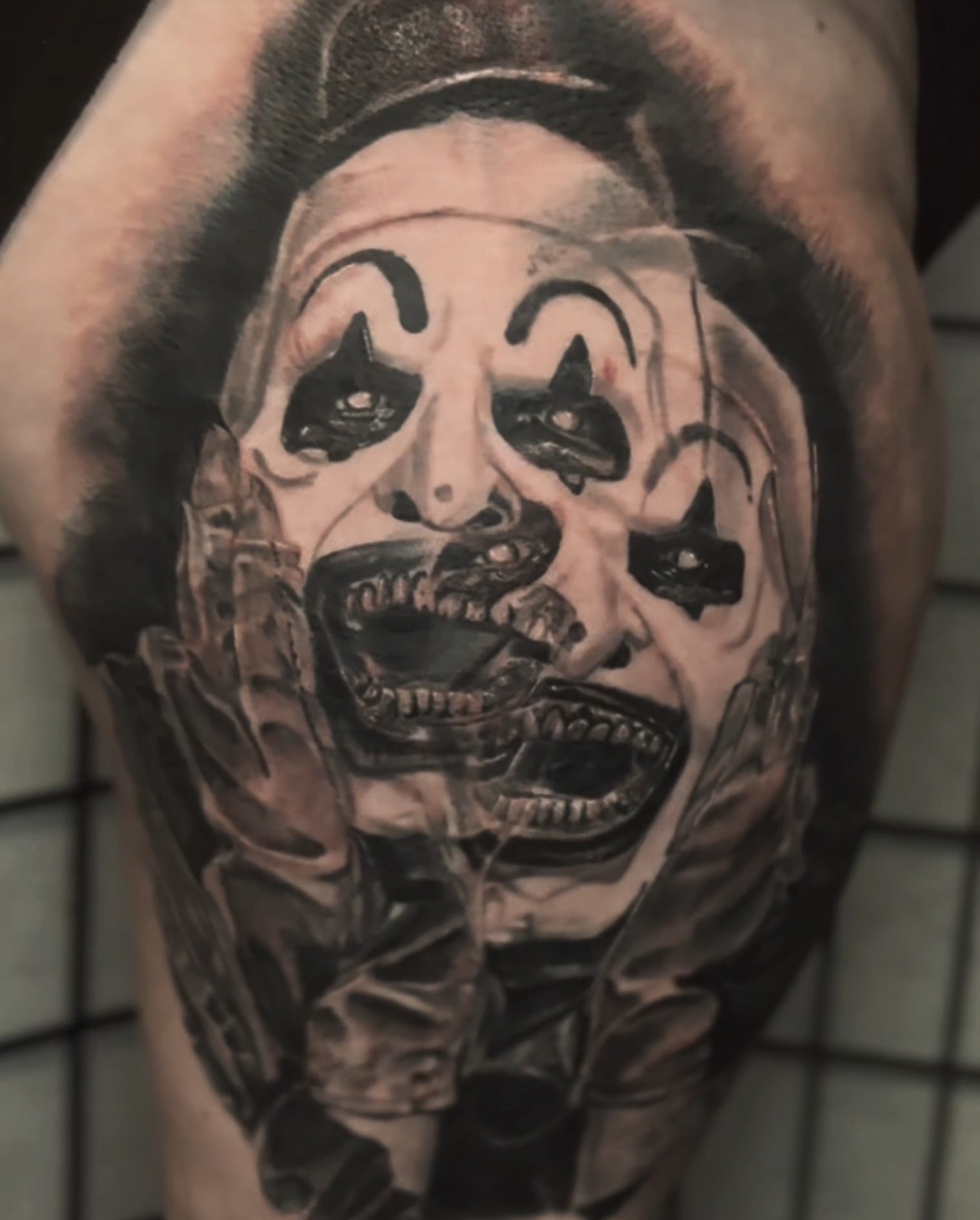 Clown face realism tattoo on the forearm by C.J. Rued