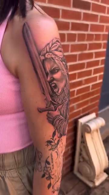 Woman with sword realism tattoo by Blake Van Vleck