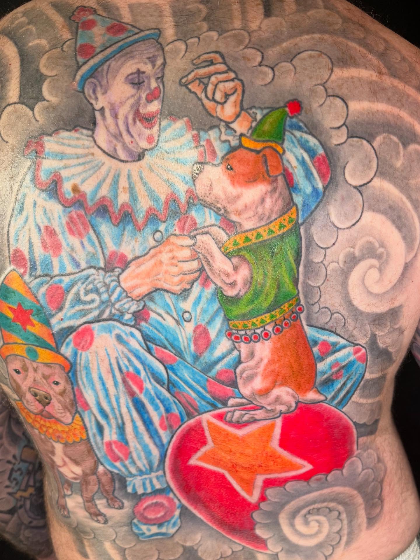Clown and pit bull American traditional tattoo on the back by Patrick Cornolo