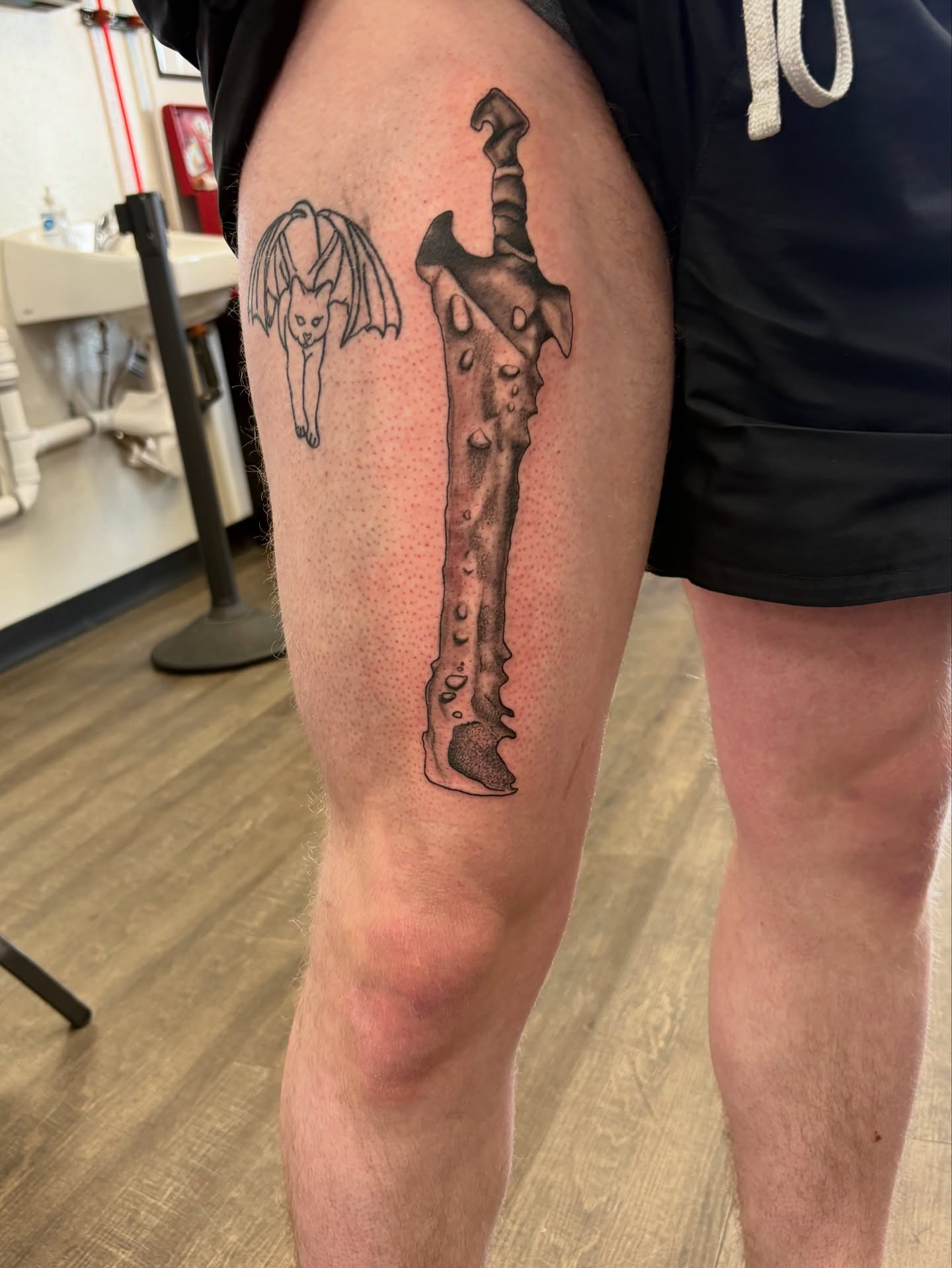 Bone black and grey tattoo on the thigh by Tori Anderson, Minneapolis, Minnesota