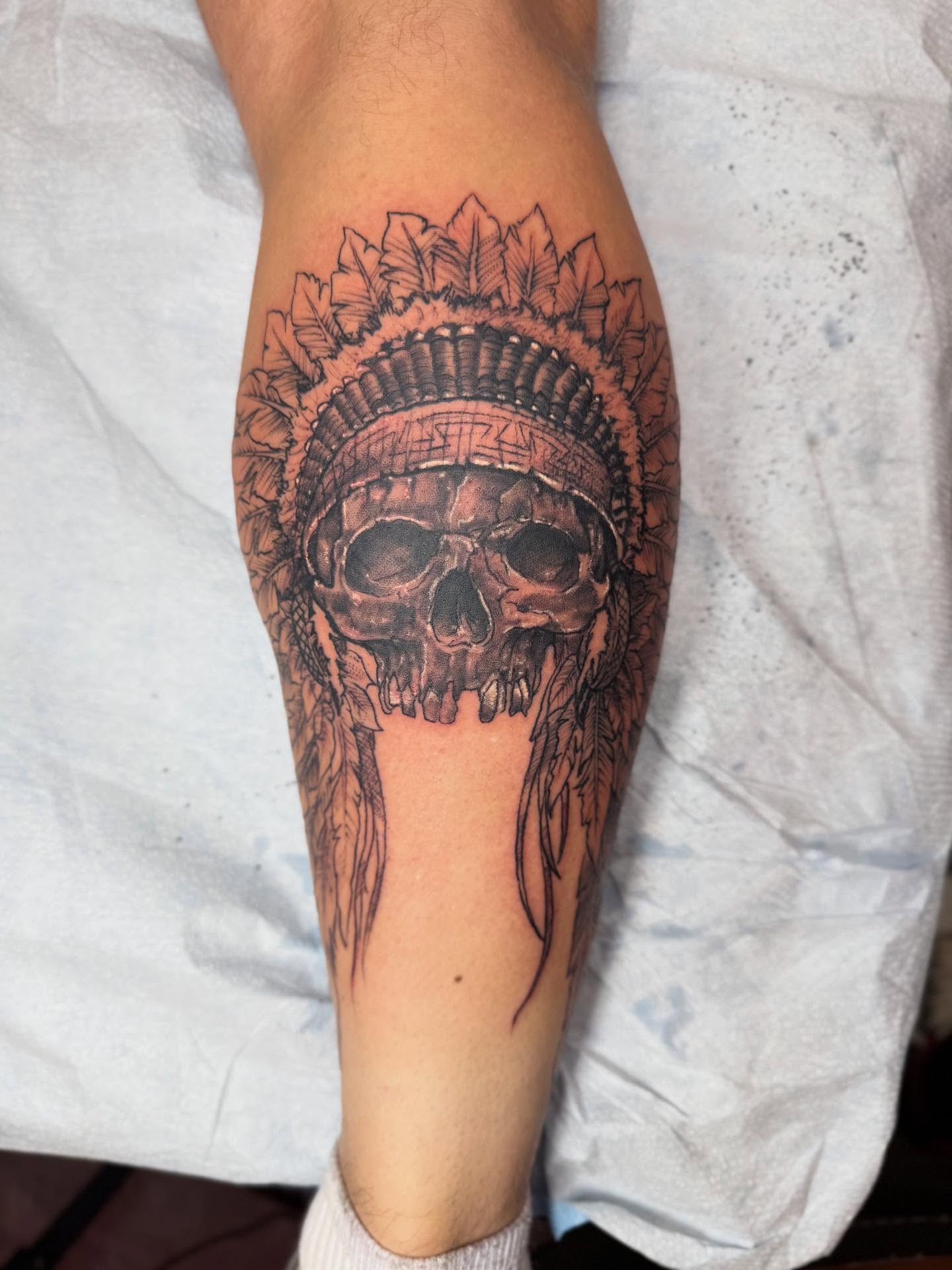 Skull with headdress realism tattoo on the forearm by Alejandro Zaragoza
