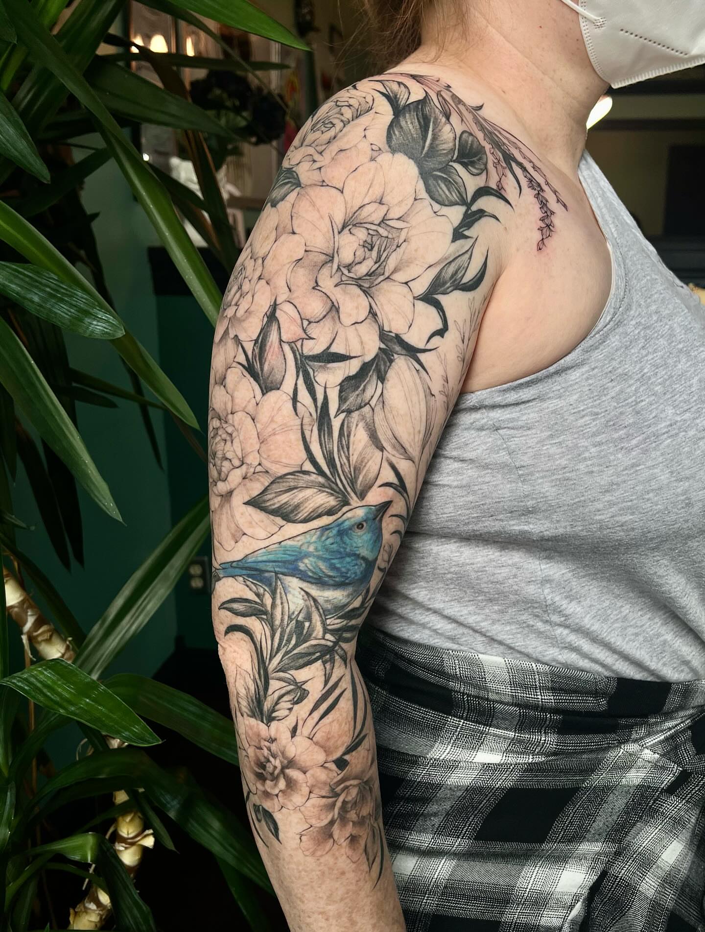 Peony and bird realism tattoo on the upper arm by ༒ boniandi༒