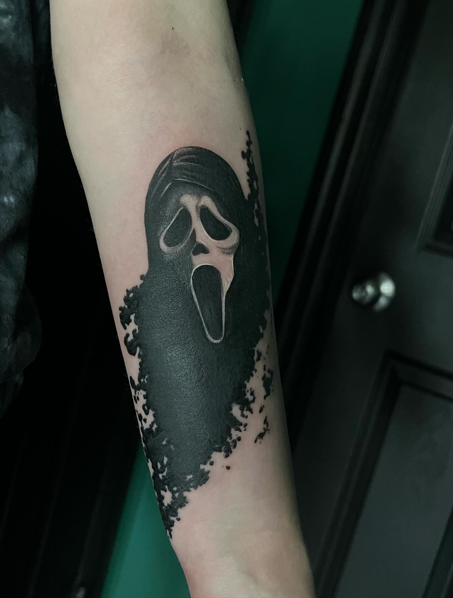 Mask black and grey tattoo on the forearm by ༒ boniandi༒