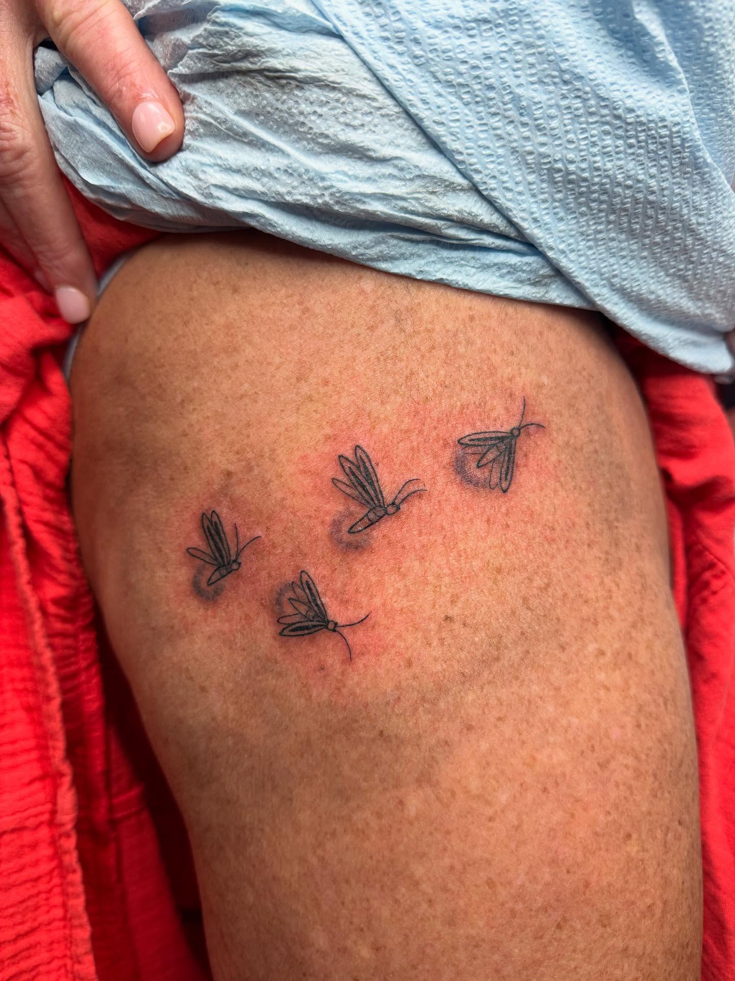 Mosquitoes black and grey tattoo on the thigh by Imani
