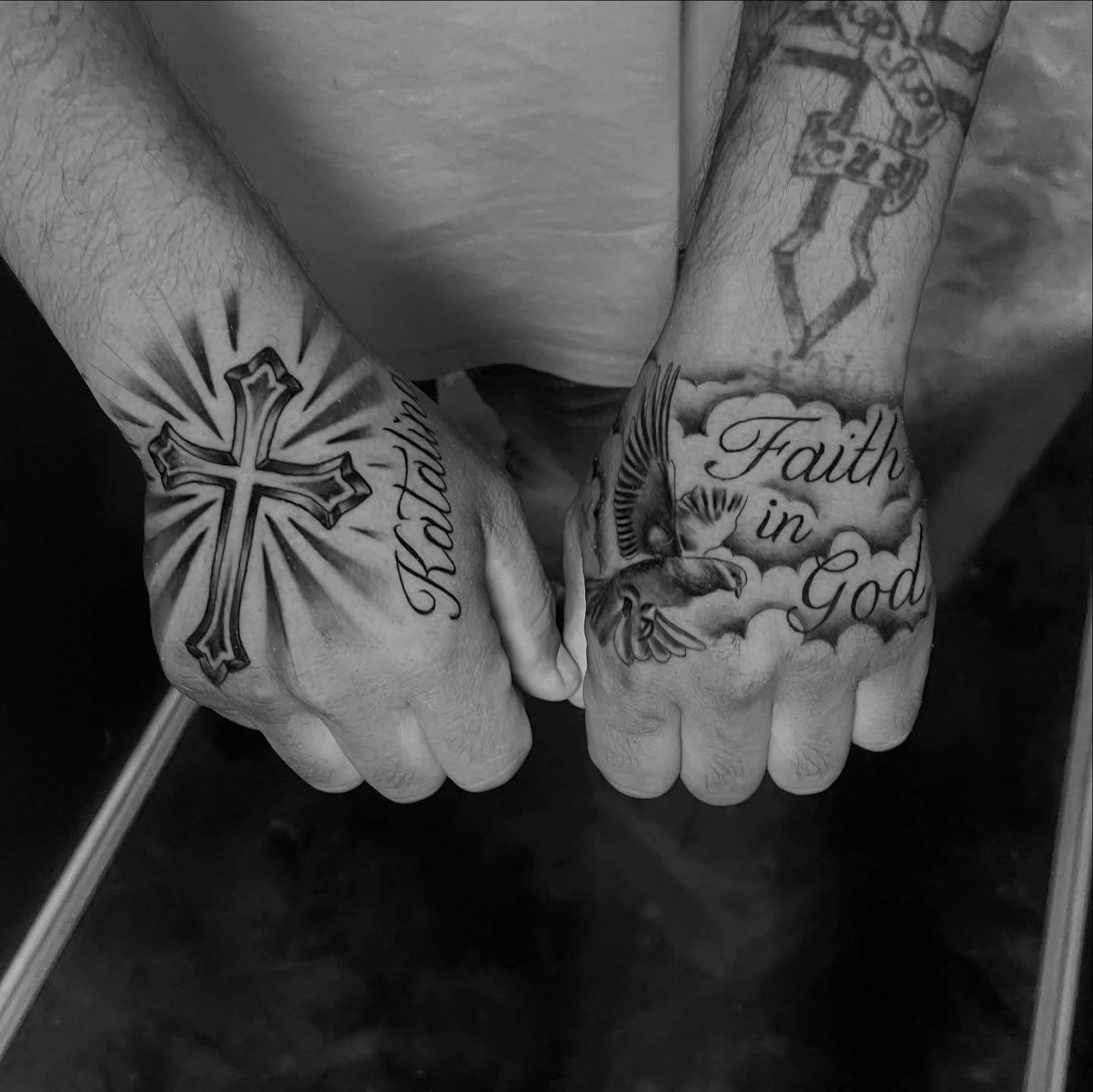 Cross and dove black and grey tattoo on the hand by Chubbs