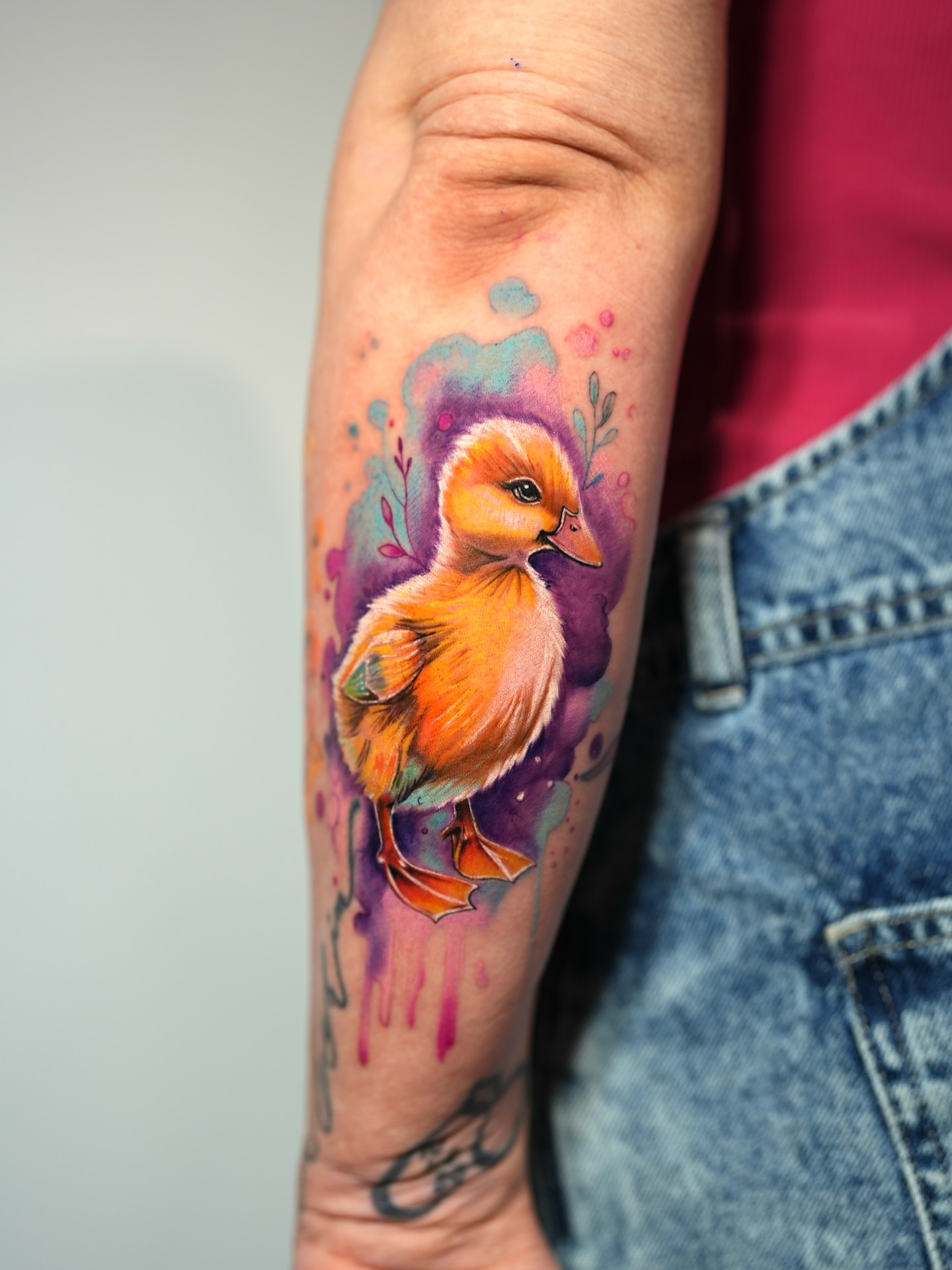 Chick watercolor tattoo on the forearm by Henry
