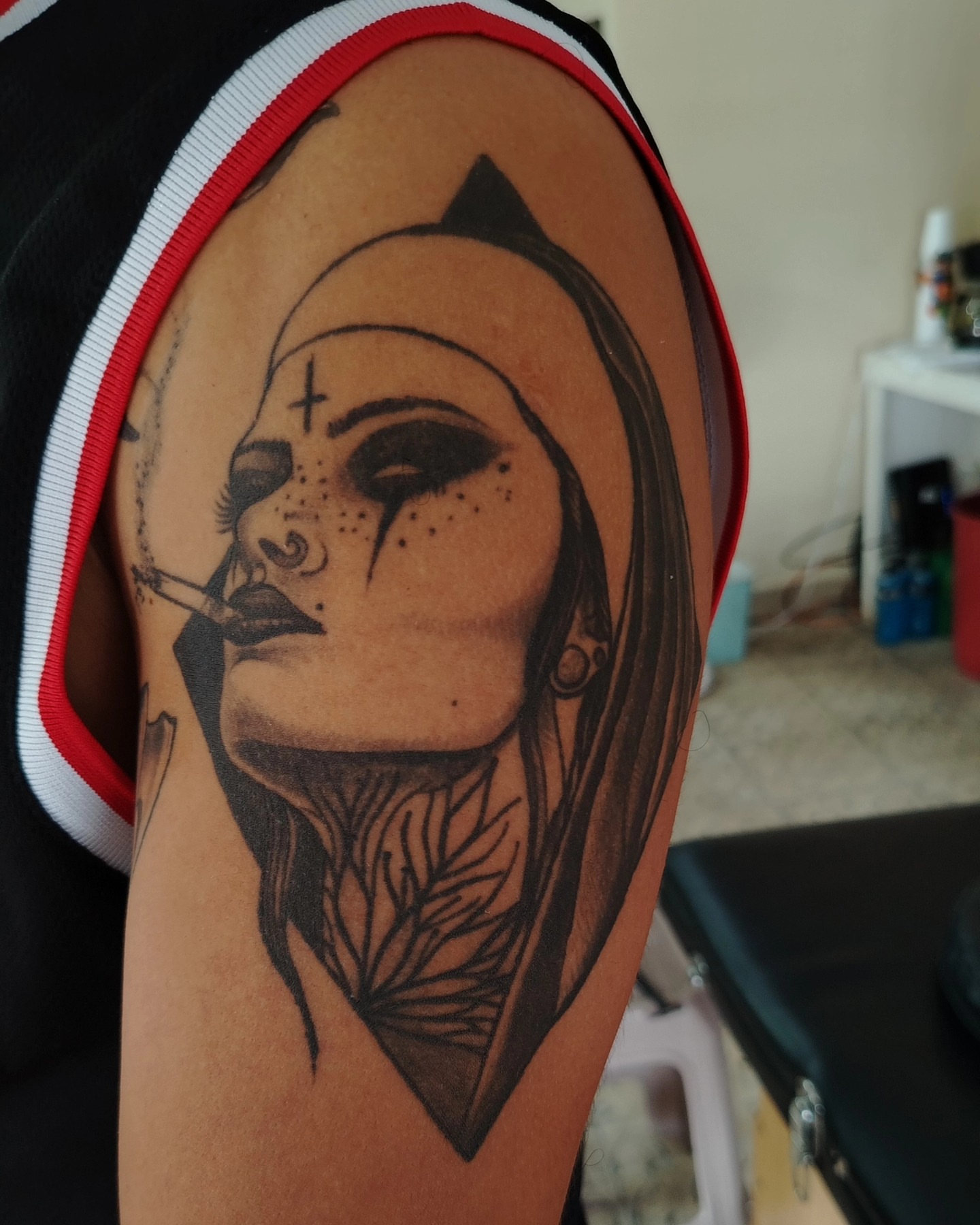 Woman smoking realism tattoo on the shoulder by Alexander Tattooink