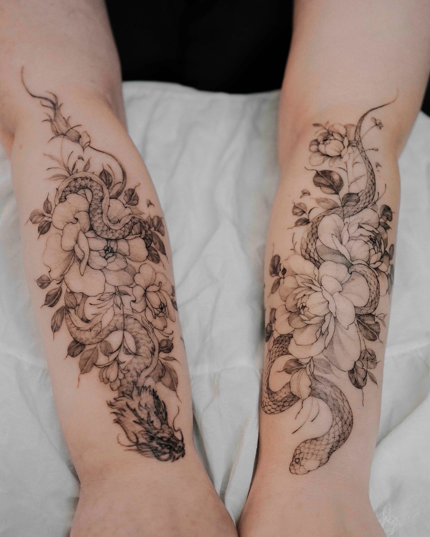 Snake and peony realism tattoo on the forearm by Yeonji