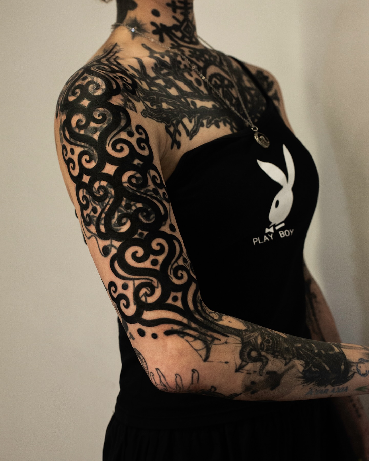 Tribal swirls tribal tattoo on the upper arm by Fisher Man