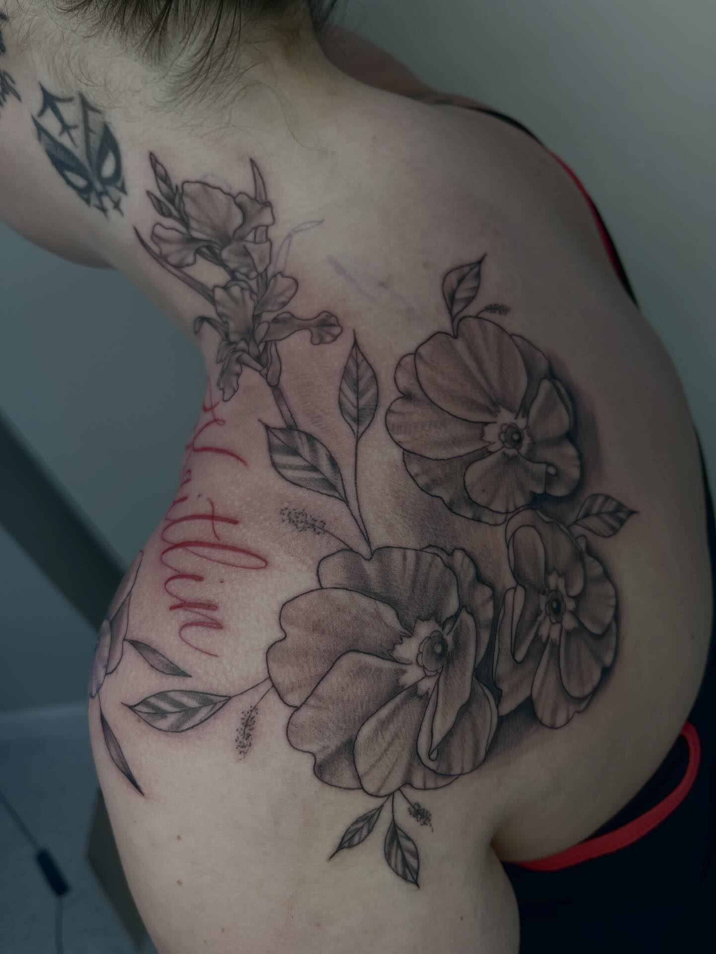 Floral bouquet black and grey tattoo on the shoulder by Kenzie Kirk
