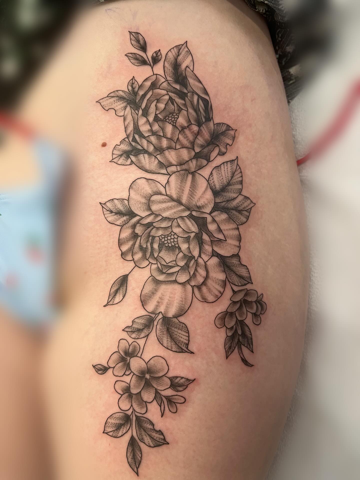 Floral arrangement realism tattoo on the shoulder by Kenzie Kirk