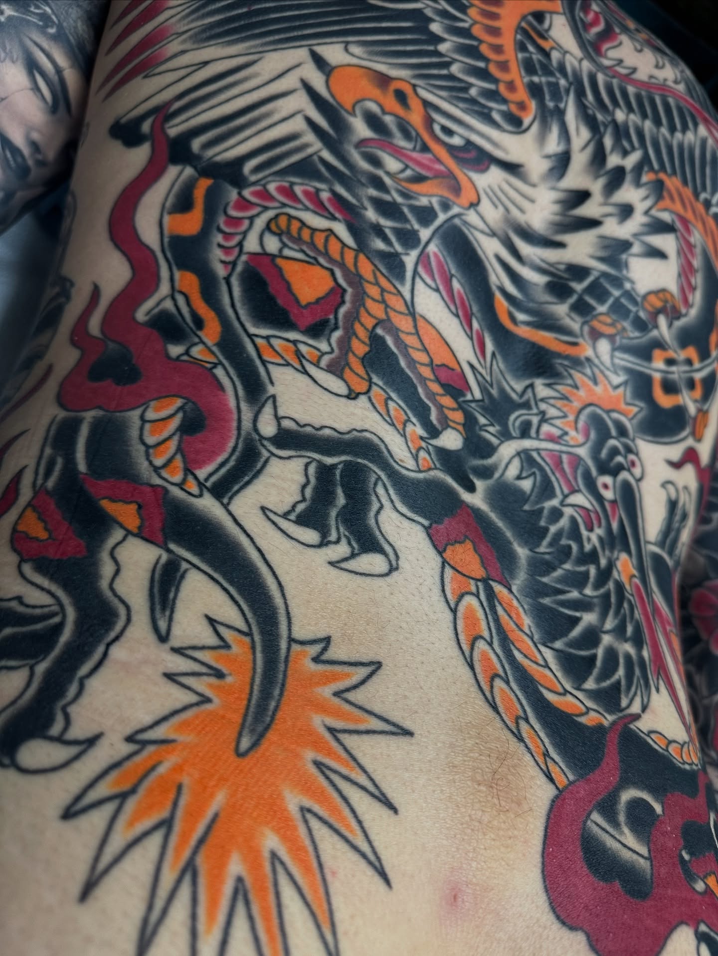 Dragon American traditional tattoo on the upper arm by Scott Allen Cooksey, Plano, Texas