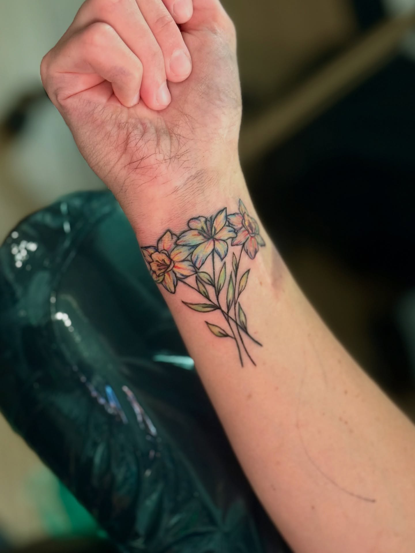 Flowers watercolor tattoo on the forearm by Khang🇻🇳