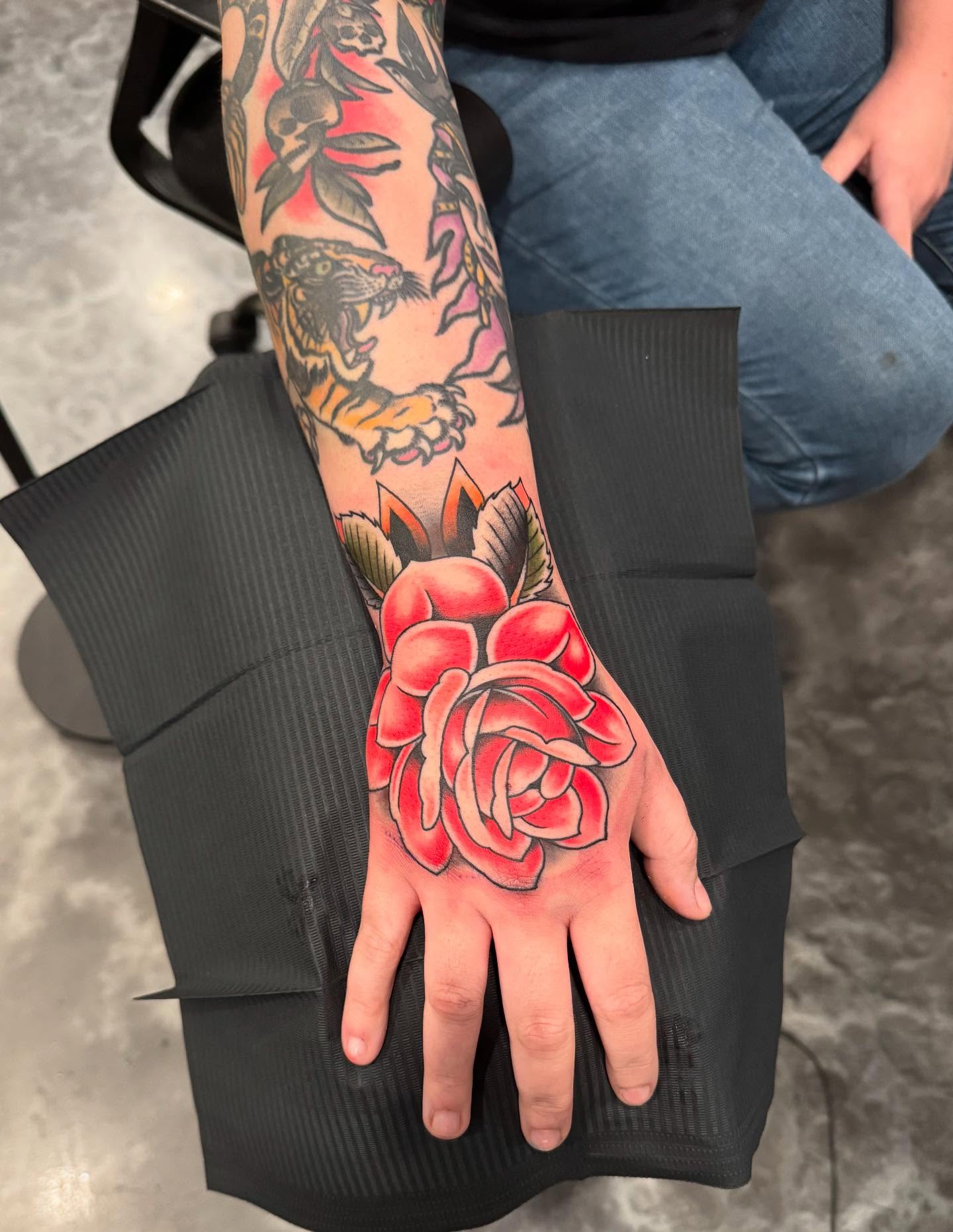 Rose American traditional tattoo on the hand by Jay Espinoza-AZ Tattooer