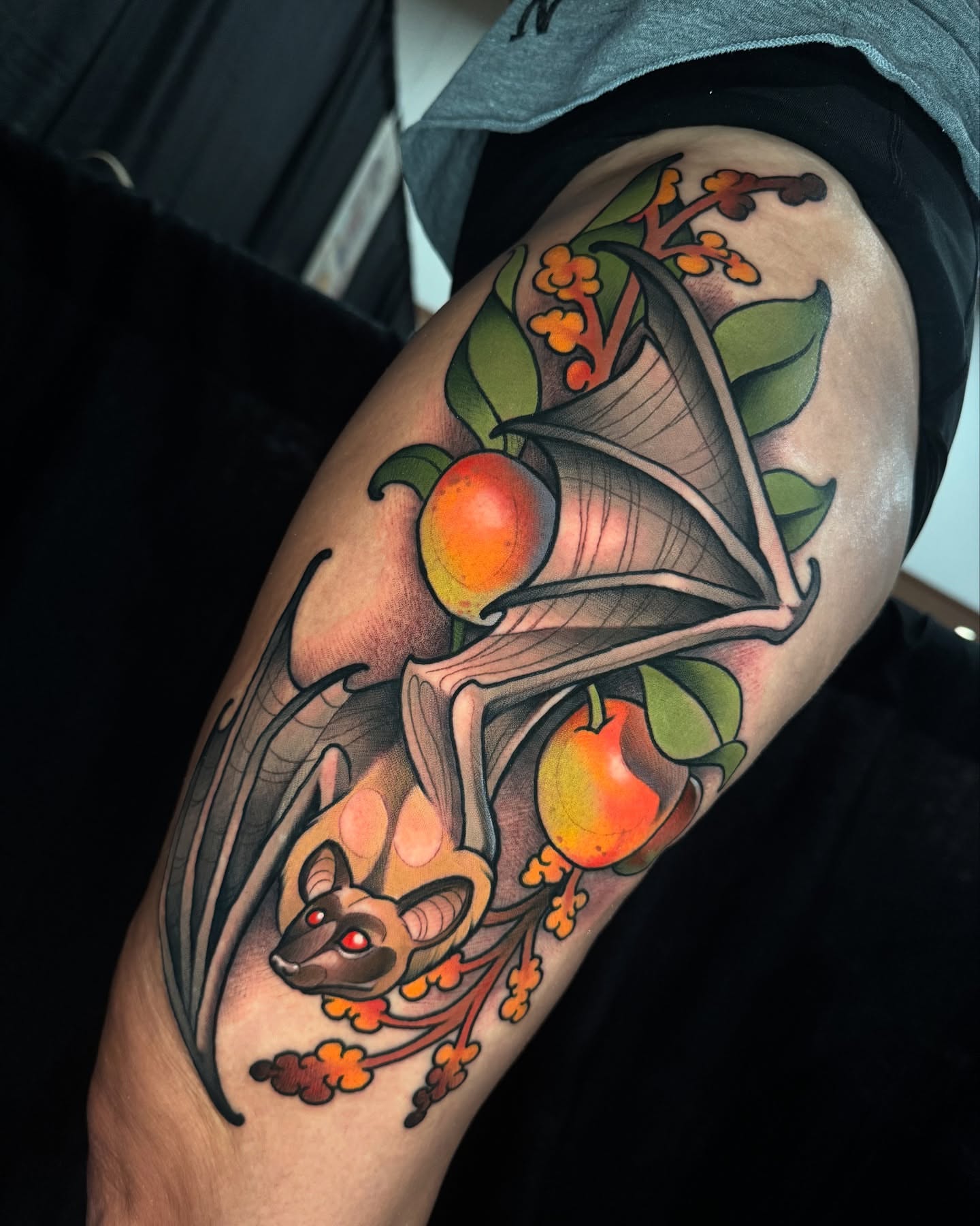Bat and fruit American traditional tattoo on the forearm by Freddie Brown, Lombard, IL