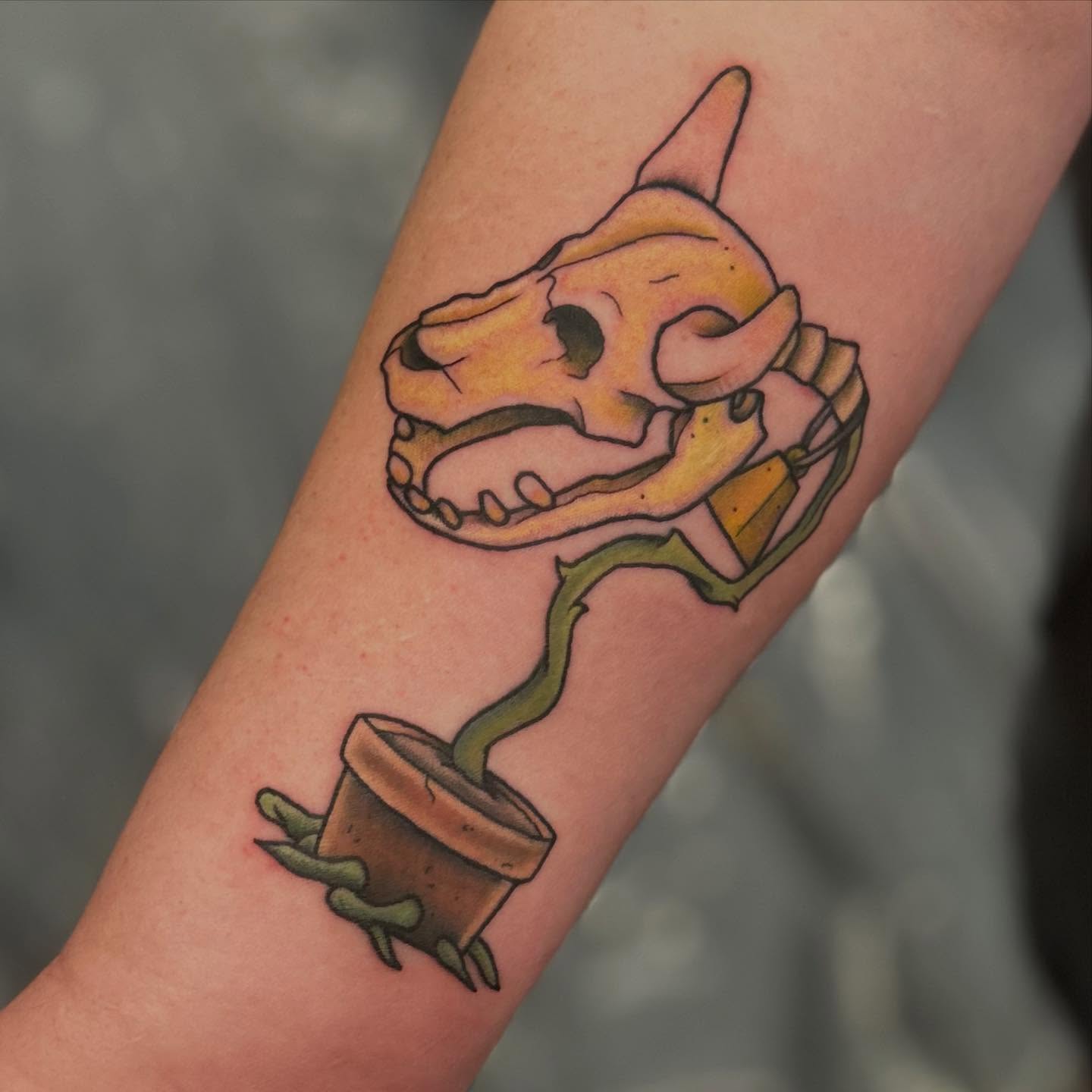 Dinosaur skull neo-traditional tattoo on the forearm by Abby Watts, Columbus, Ohio