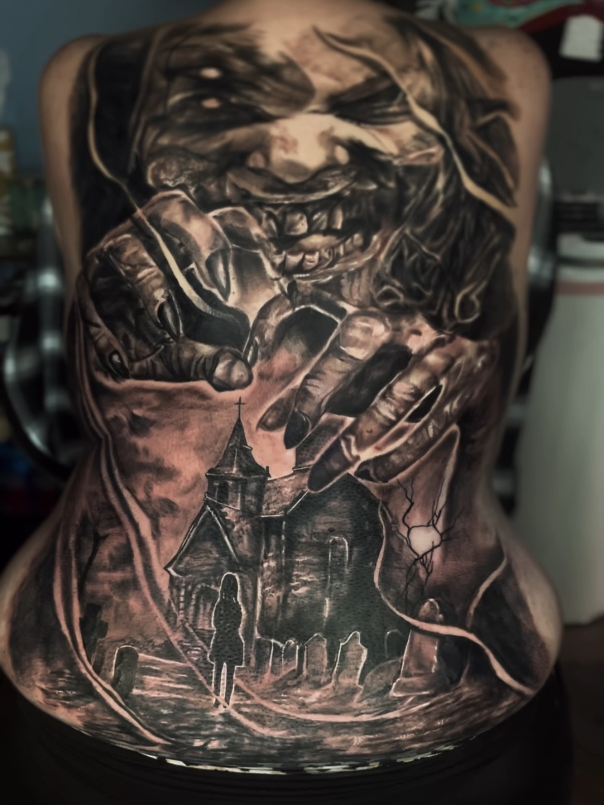 Ghoul and cemetery dark realism tattoo on the torso by C.J. Rued