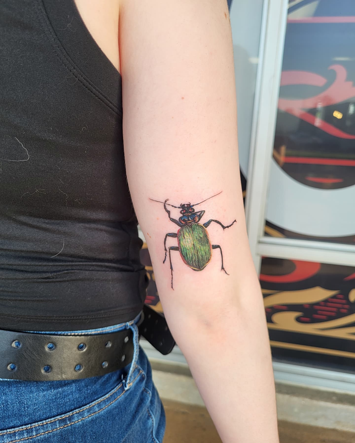Beetle realism tattoo on the forearm by Jenna 🖤 Tattoos Denton TX