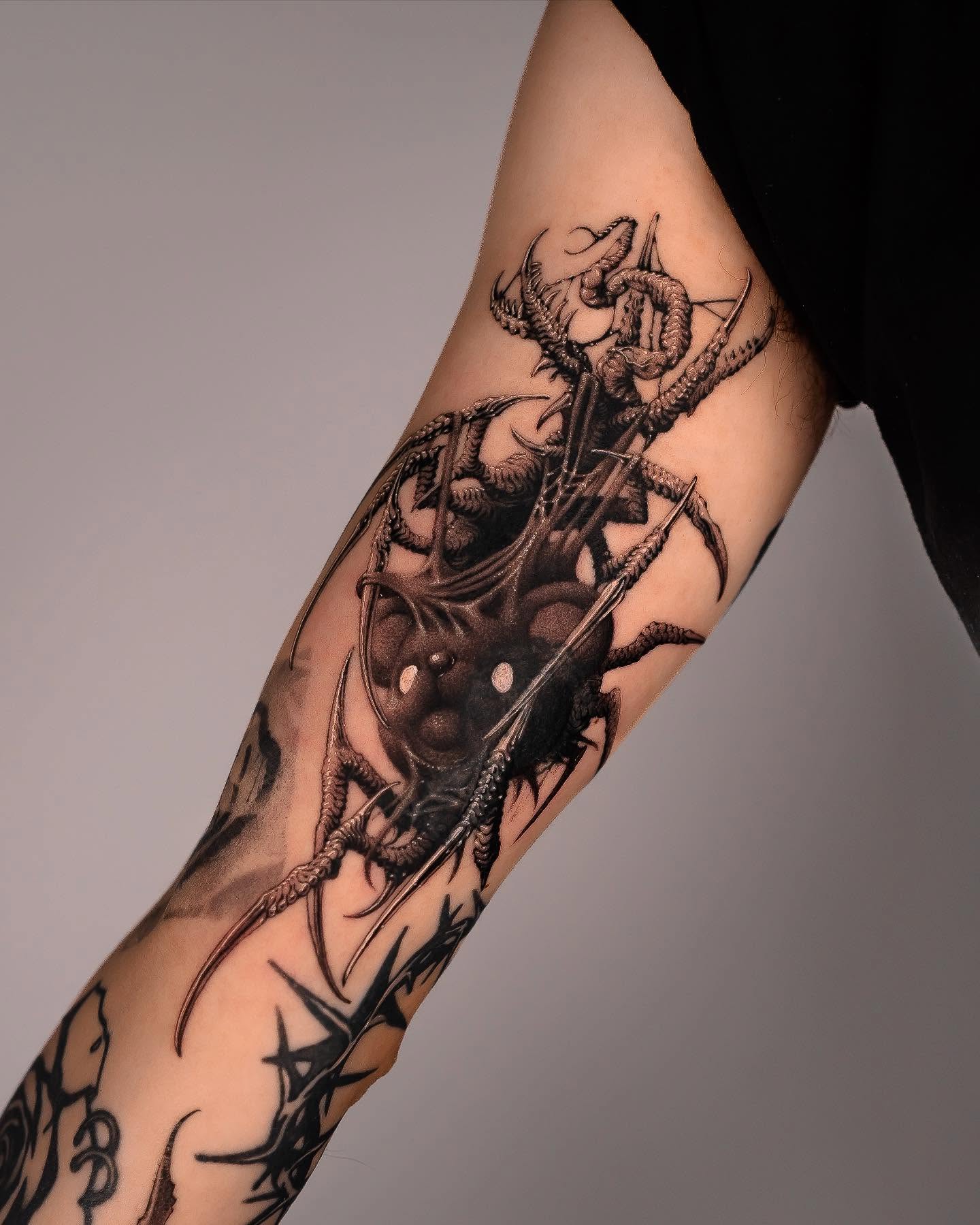 Dragon and sword realism tattoo on the forearm by Yujhi