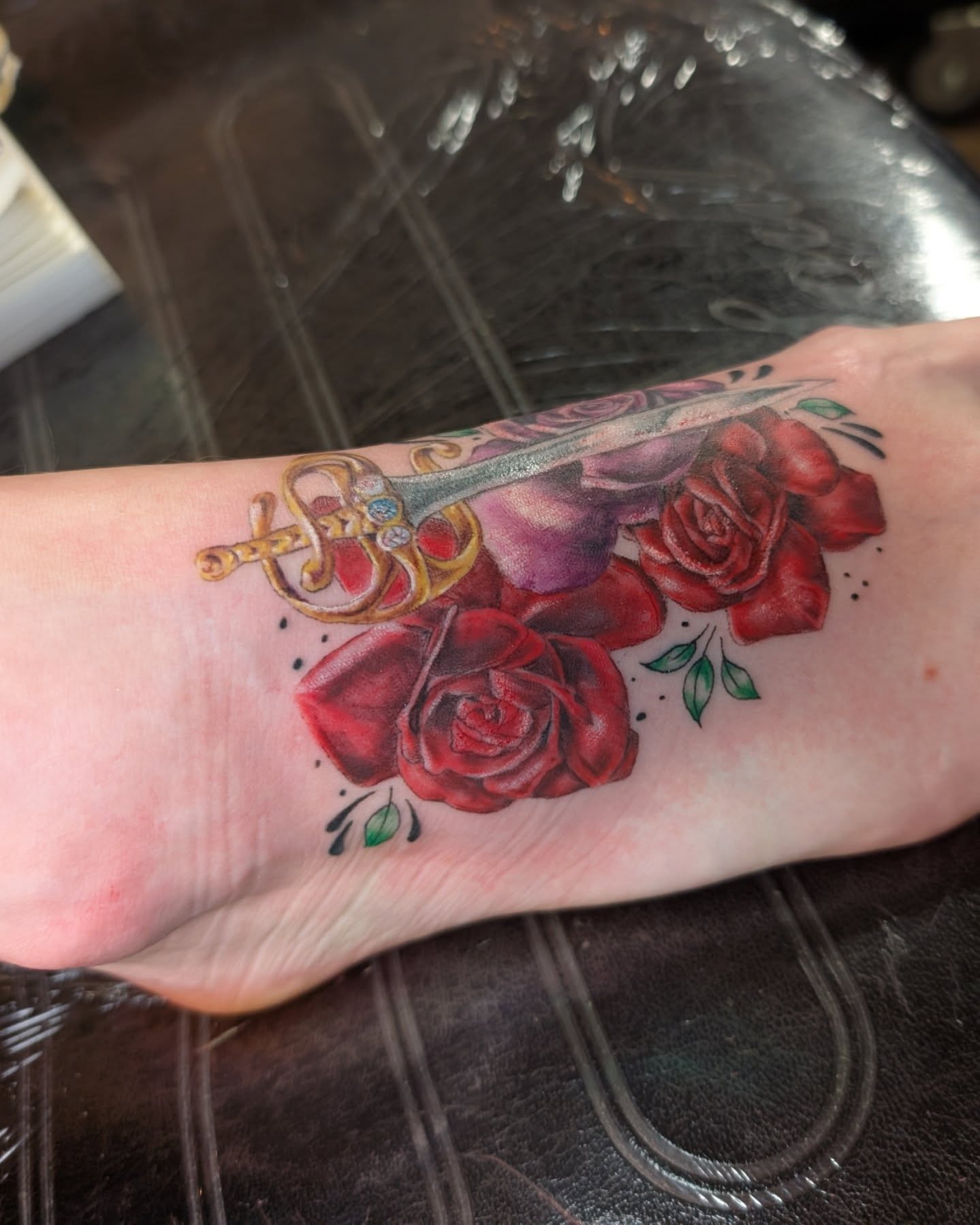Roses and sword realism tattoo on the foot by Cat