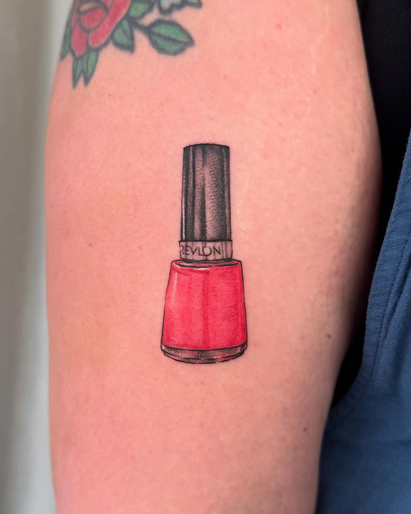 Nail polish bottle realism tattoo on the forearm by RyAnn Lynn
