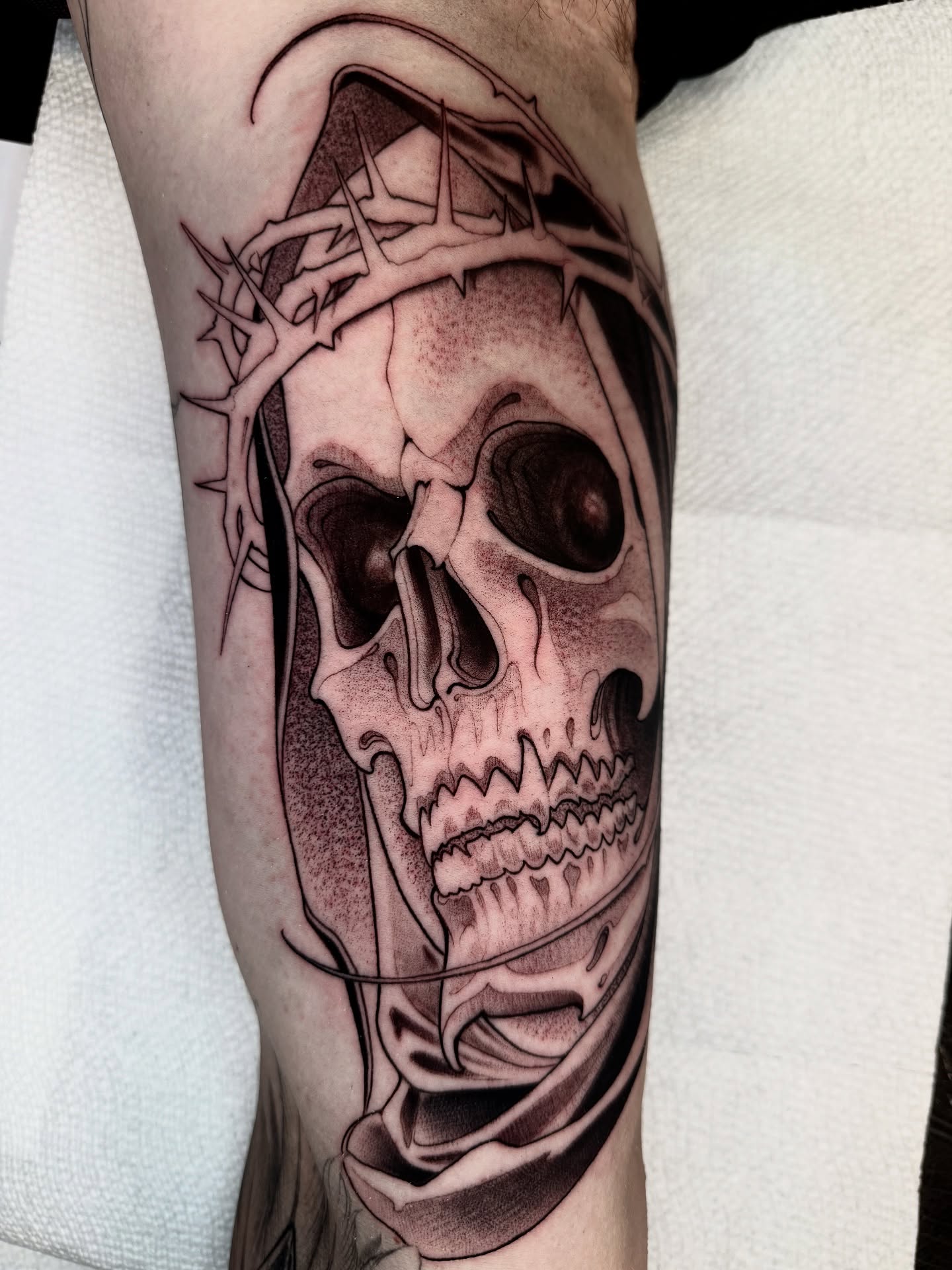 Skull with crown of thorns realism tattoo on the forearm by Angelo Buonanno, Las Vegas, Nevada
