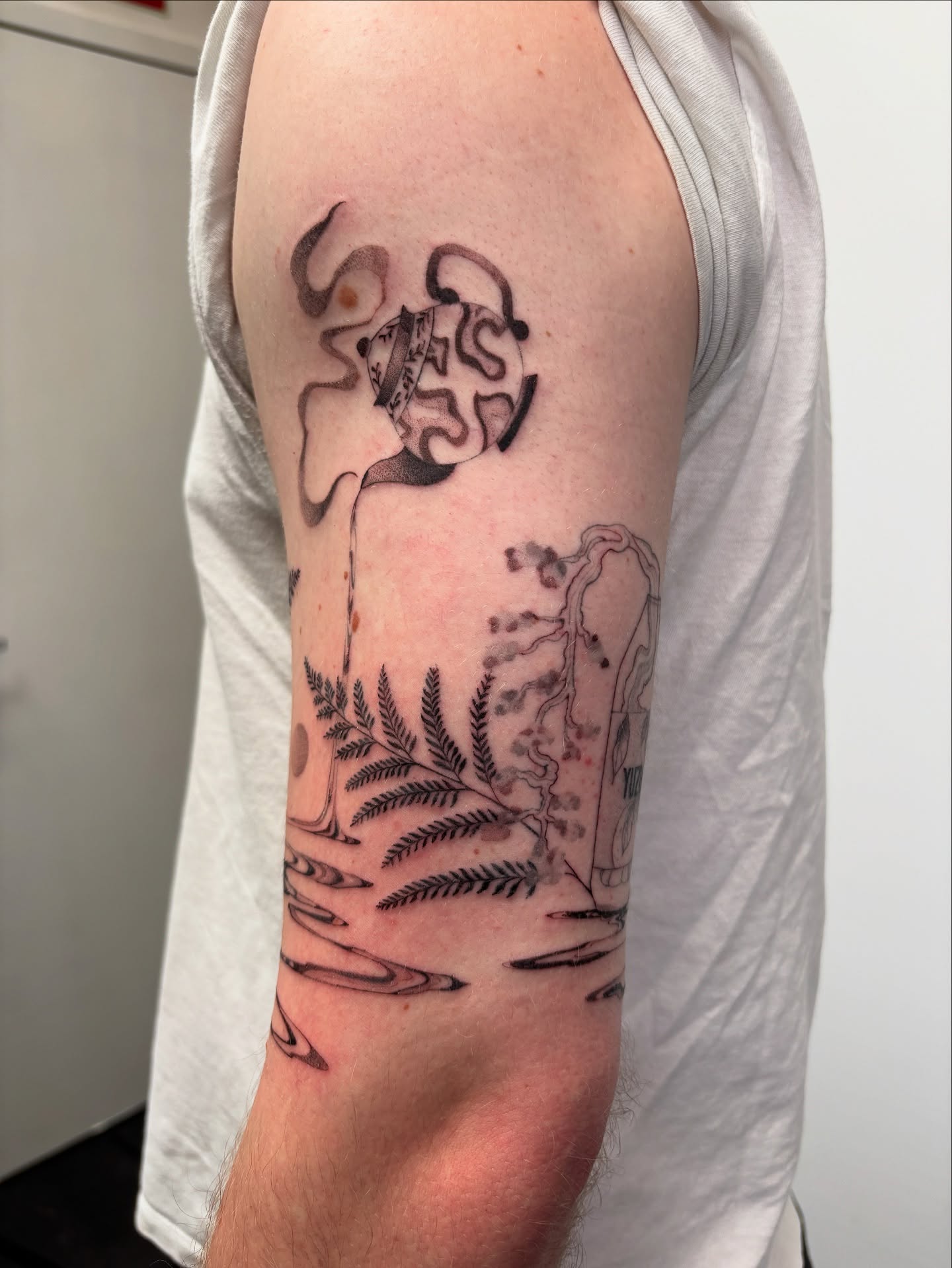 Abstract design black and grey tattoo on the forearm by sago, Berkeley, California