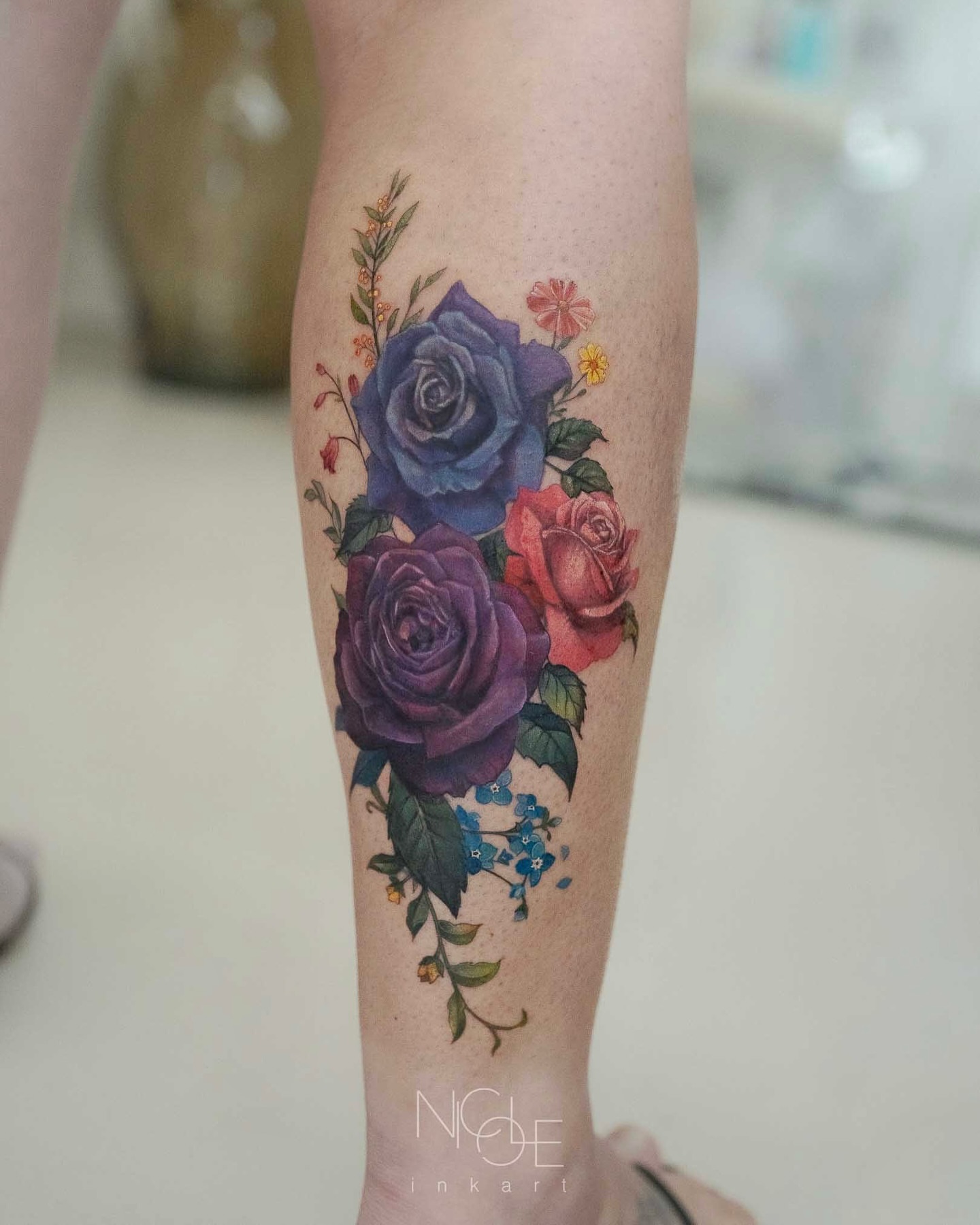 Floral bouquet realism tattoo on the forearm by 𝐍𝐈𝐂𝐎𝐋𝐄 𝐋