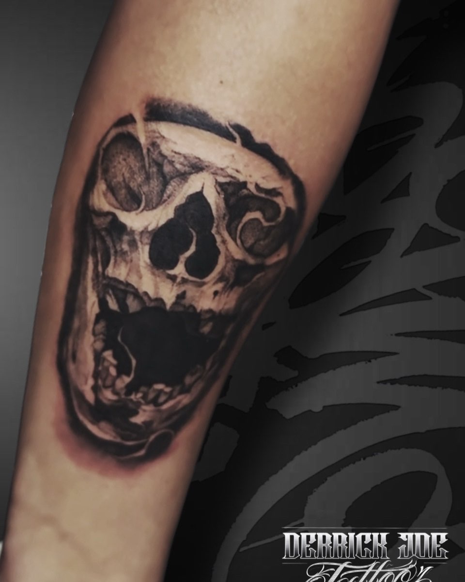 Skull realism tattoo on the forearm by Derrick Joe tattoos
