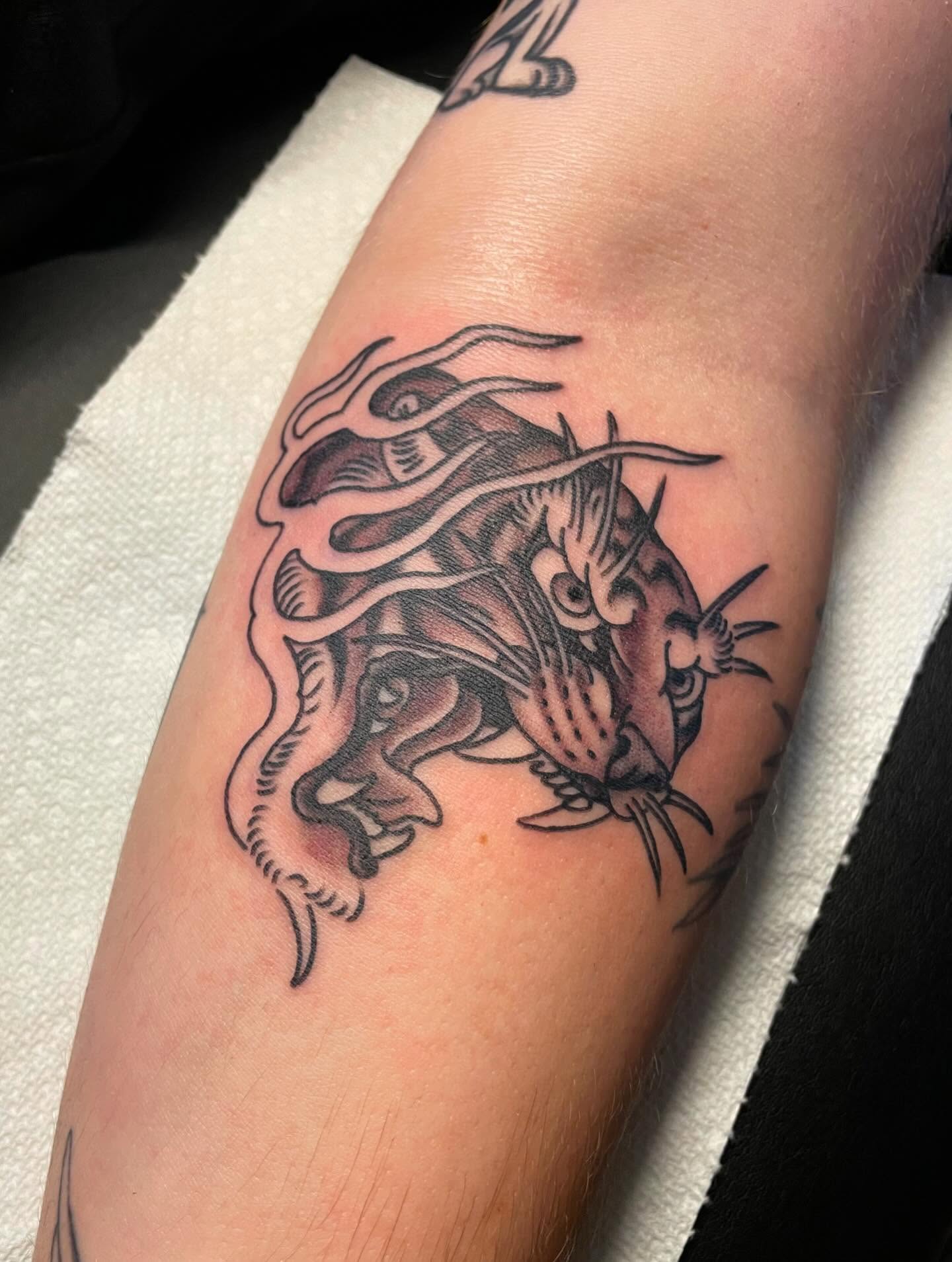 Fish black and grey tattoo on the forearm by Hannah Edwards, Austin, Texas