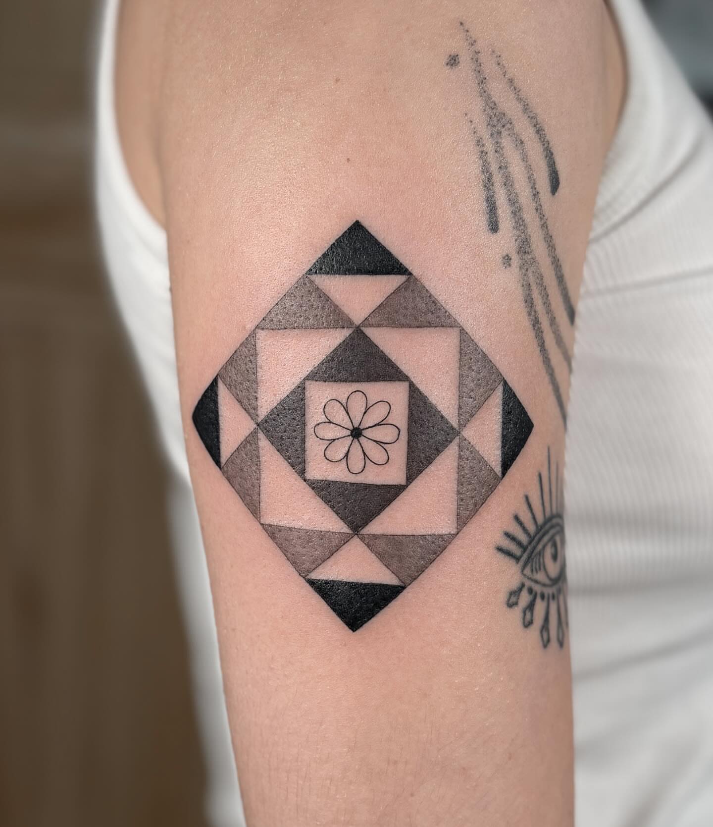 Geometric pattern geometric tattoo on the forearm by Anna Sage