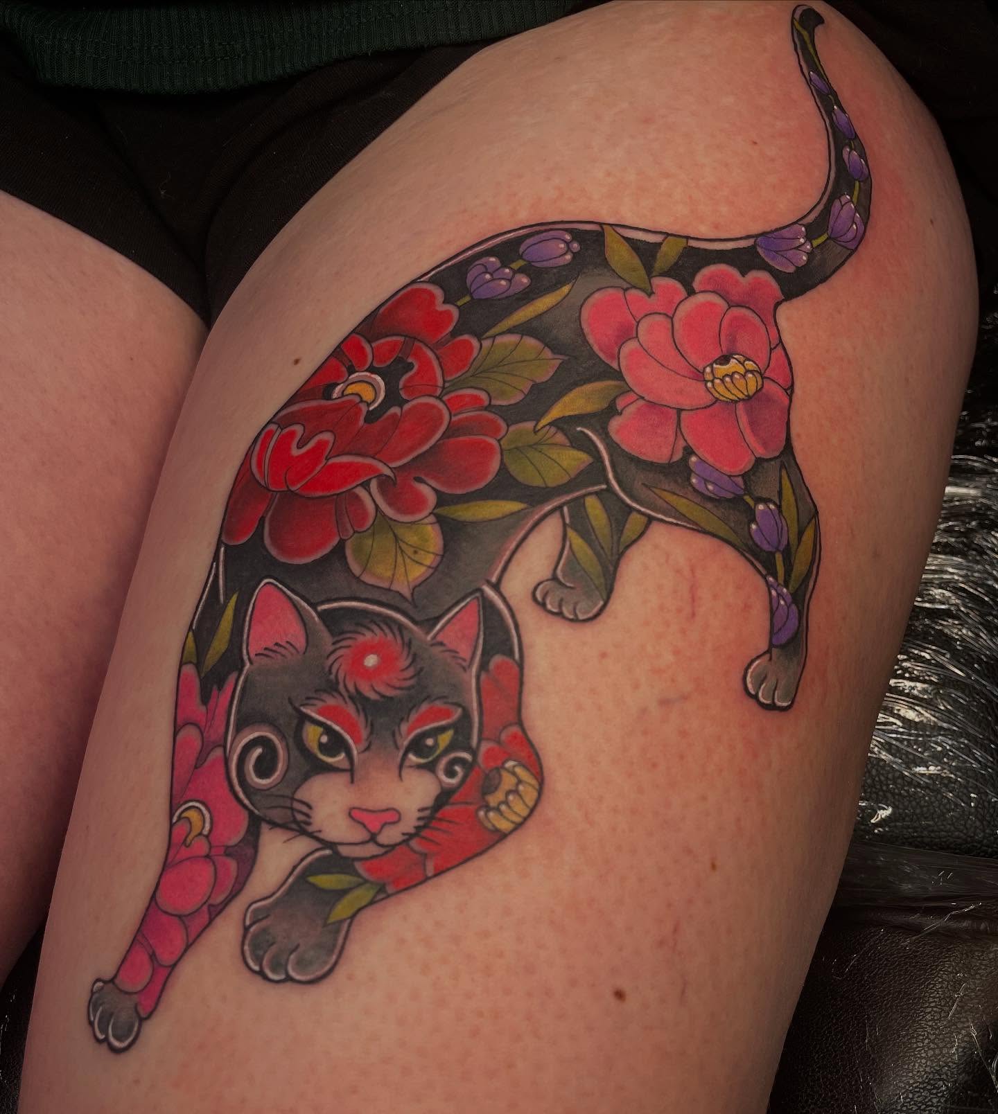 Cat and flowers American traditional tattoo on the thigh by Lauren Sisouphanh, Canton, Ohio