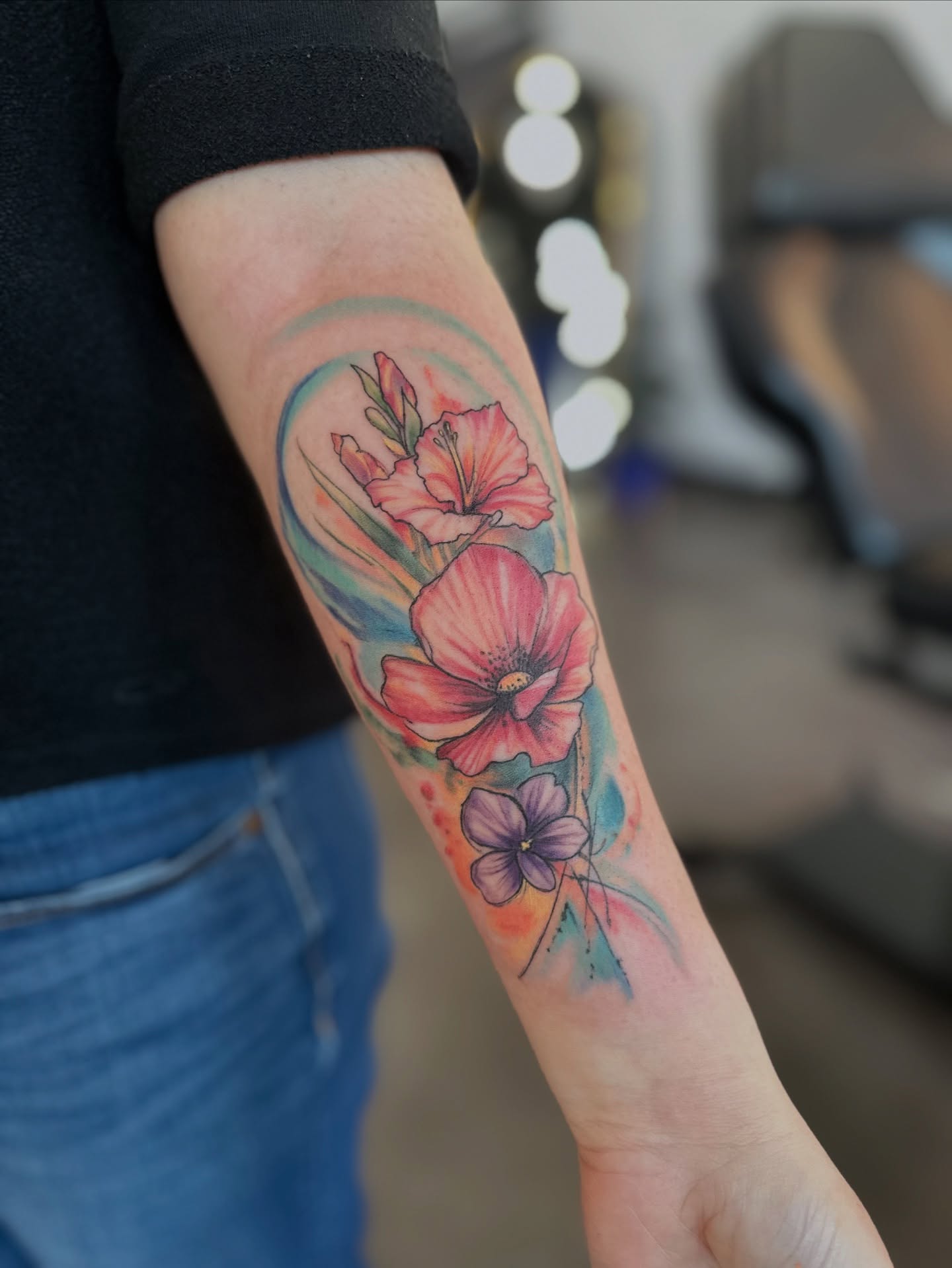 Watercolor flowers watercolor tattoo on the forearm by Cameron Hobbs, Woodbridge, Virginia
