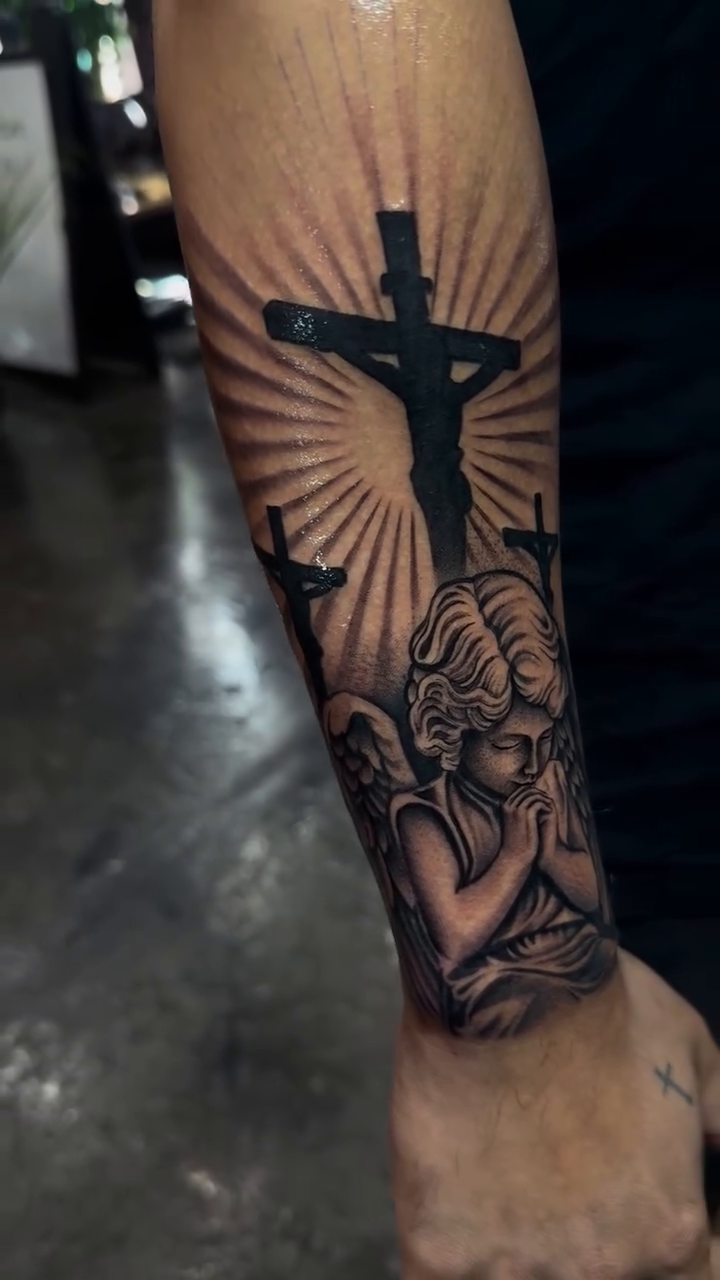 Crucifix and angel realism tattoo by Bernie calderon, Fresno, California