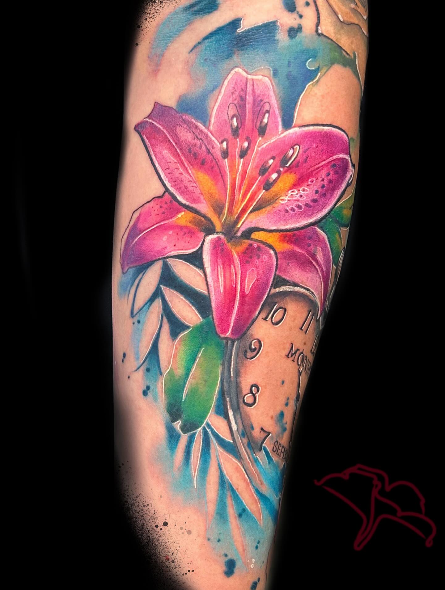 Lily and clock watercolor tattoo on the forearm by Aline Petunia, Los Angeles, California