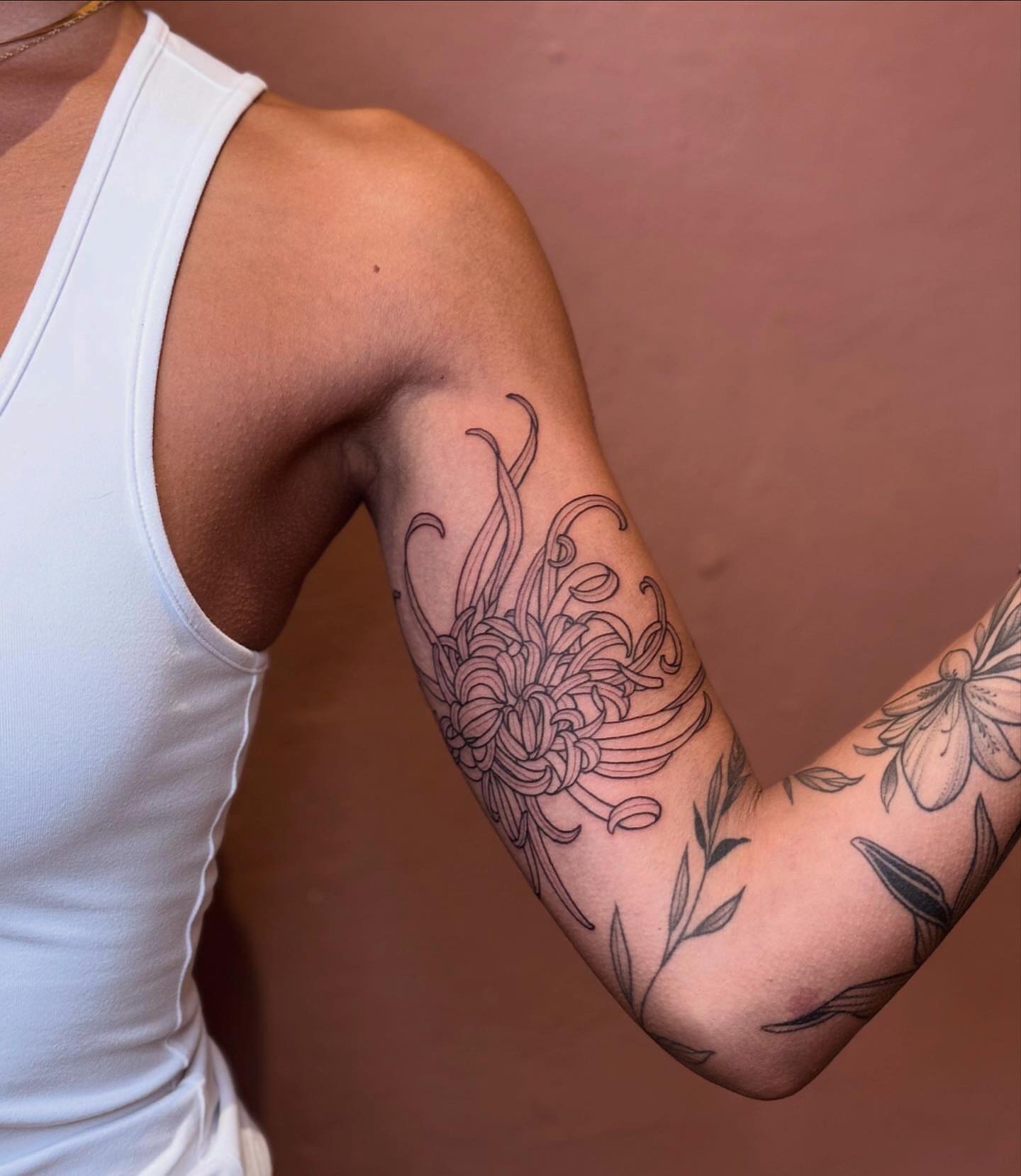 Floral design black and grey tattoo on the forearm by 𝘉𝘢𝘺 𝘈𝘳𝘦𝘢 𝘛𝘢𝘵𝘵𝘰𝘰 𝘈𝘳𝘵𝘪𝘴𝘵, Oakland, California