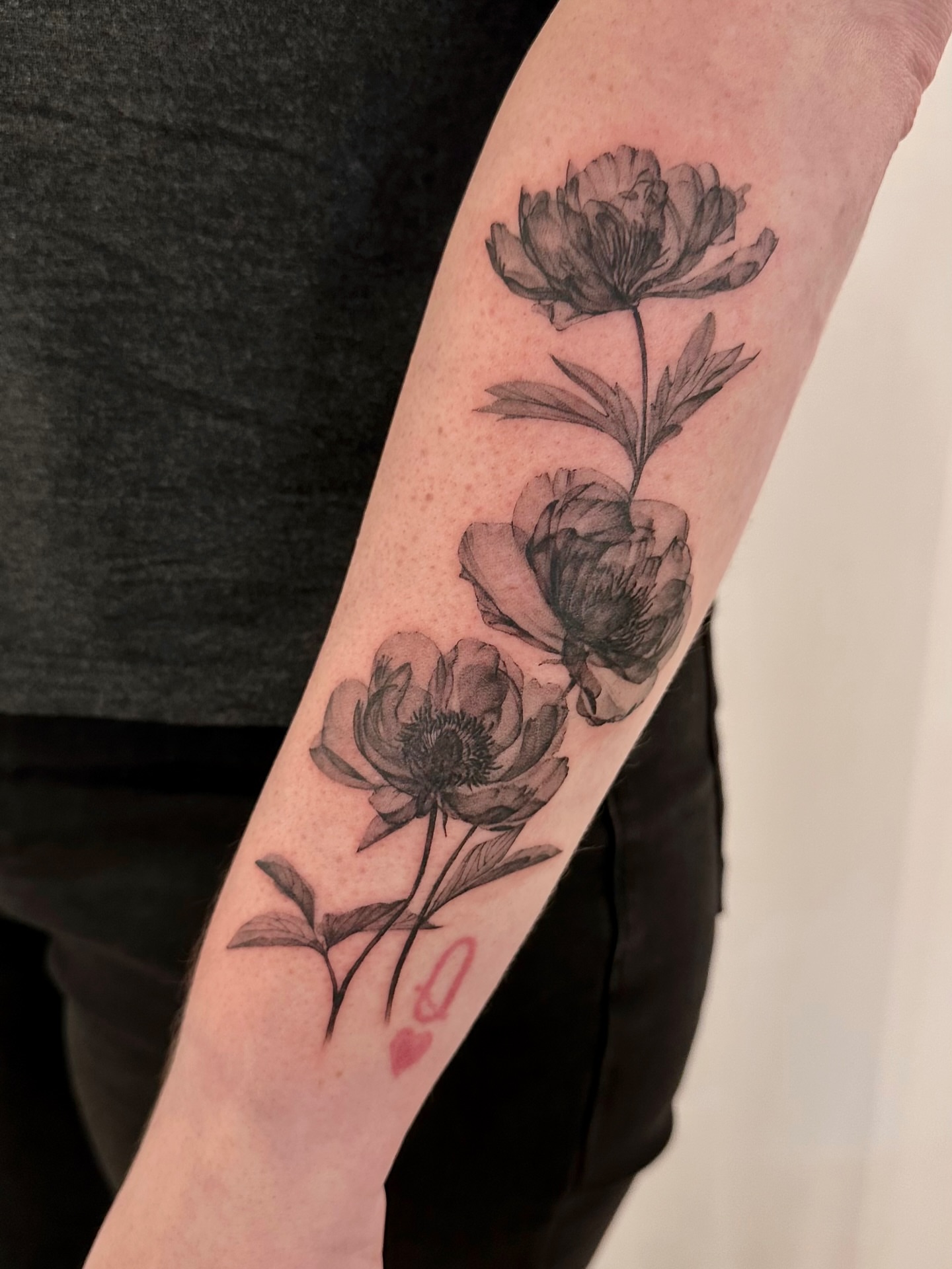 Peony flowers black and grey tattoo on the forearm by Soohee Jin✨ NYC tattoo artist