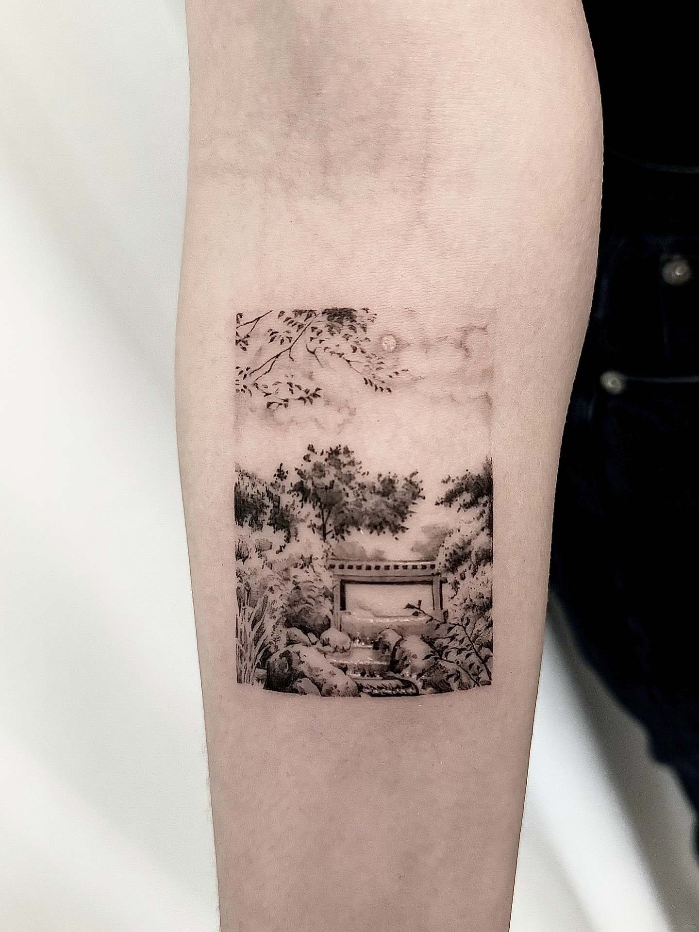 Japanese garden realism tattoo on the forearm by Oori