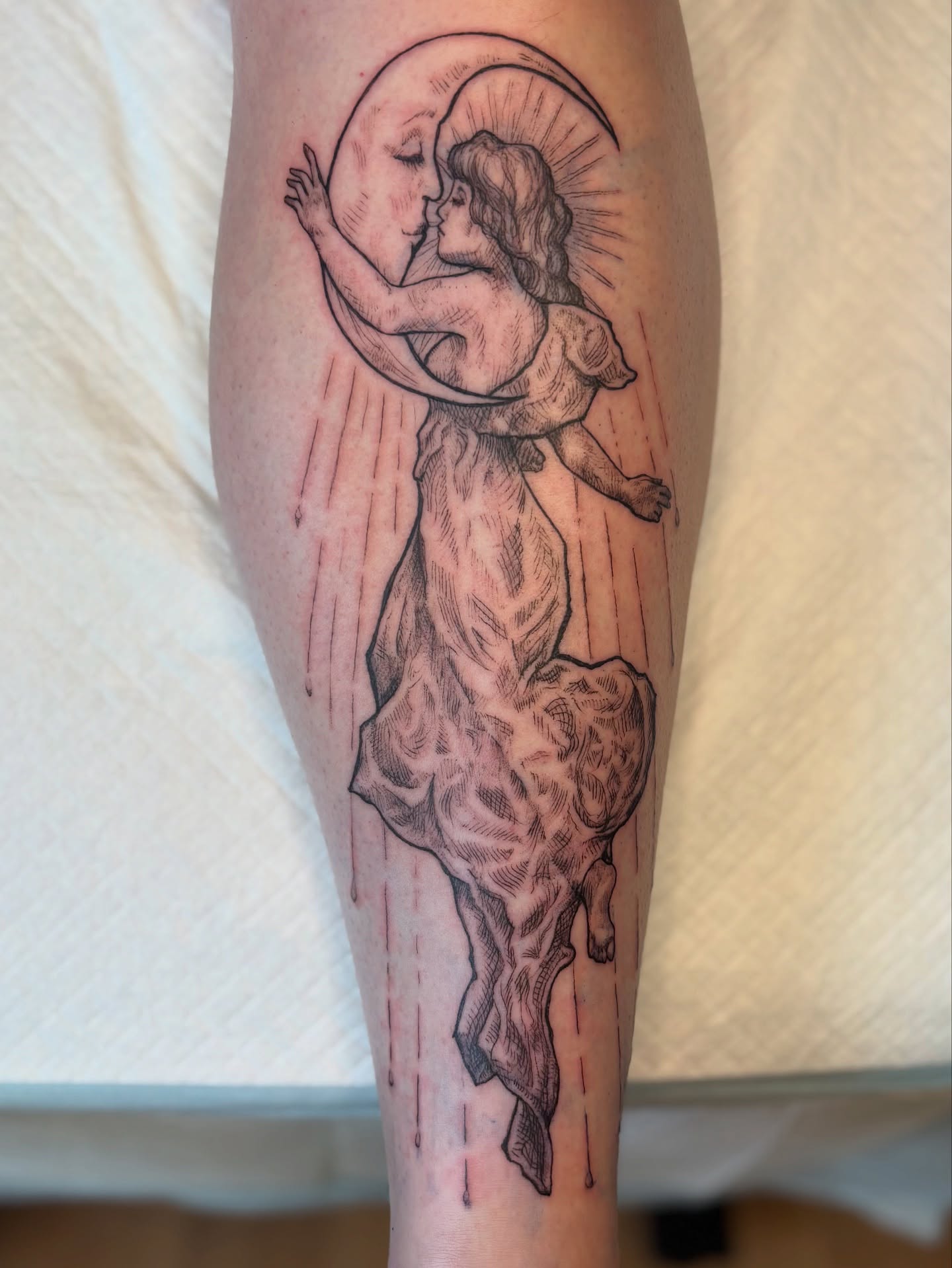 Angel and moon black and grey tattoo on the forearm by Wren Cavanaugh Tattoos, Seattle, Washington