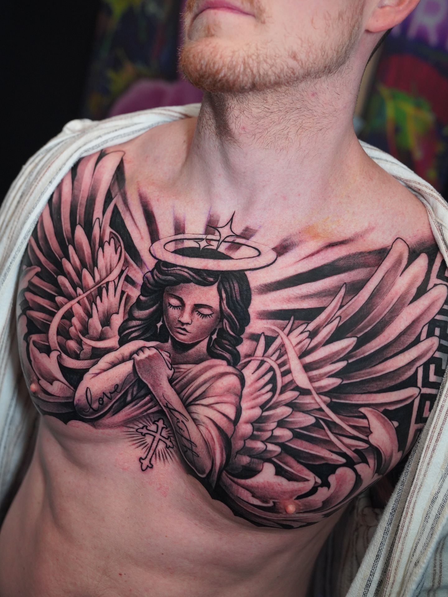 Angel American traditional tattoo on the chest by Artem Kunakuzin