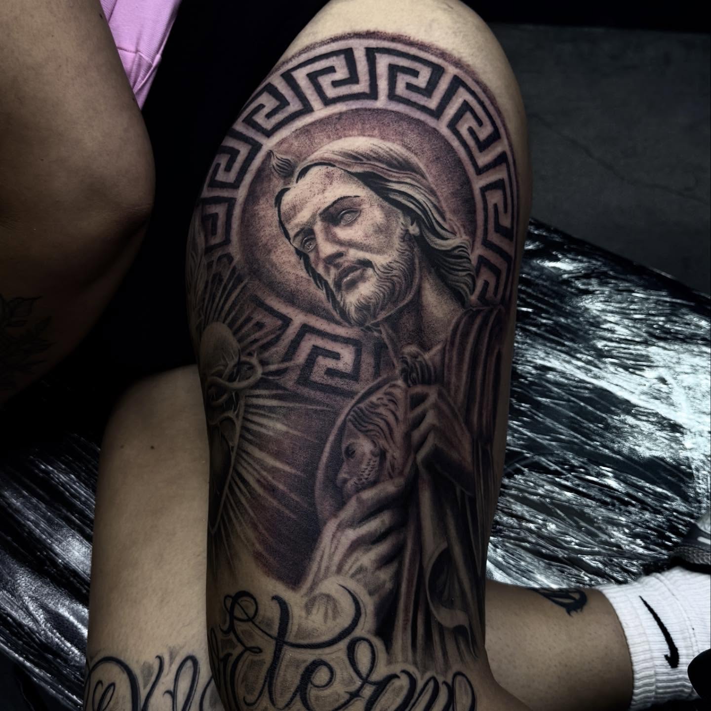 Religious figure realism tattoo on the forearm by Joey Moreno